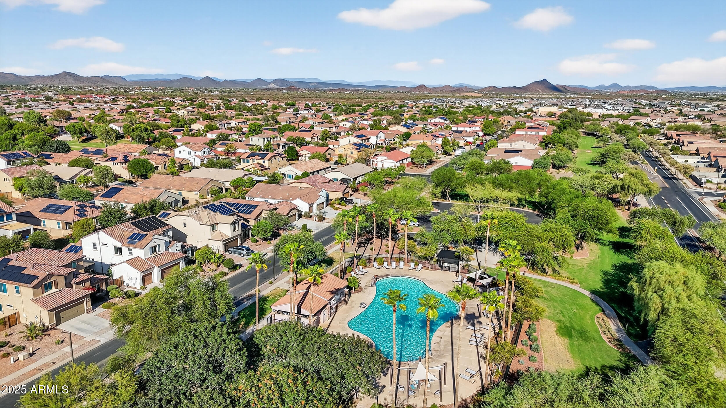 17368 West Red Bird Road Surprise, AZ 85387 - Photo 76 of 82 an aerial view of residential houses with outdoor space and trees