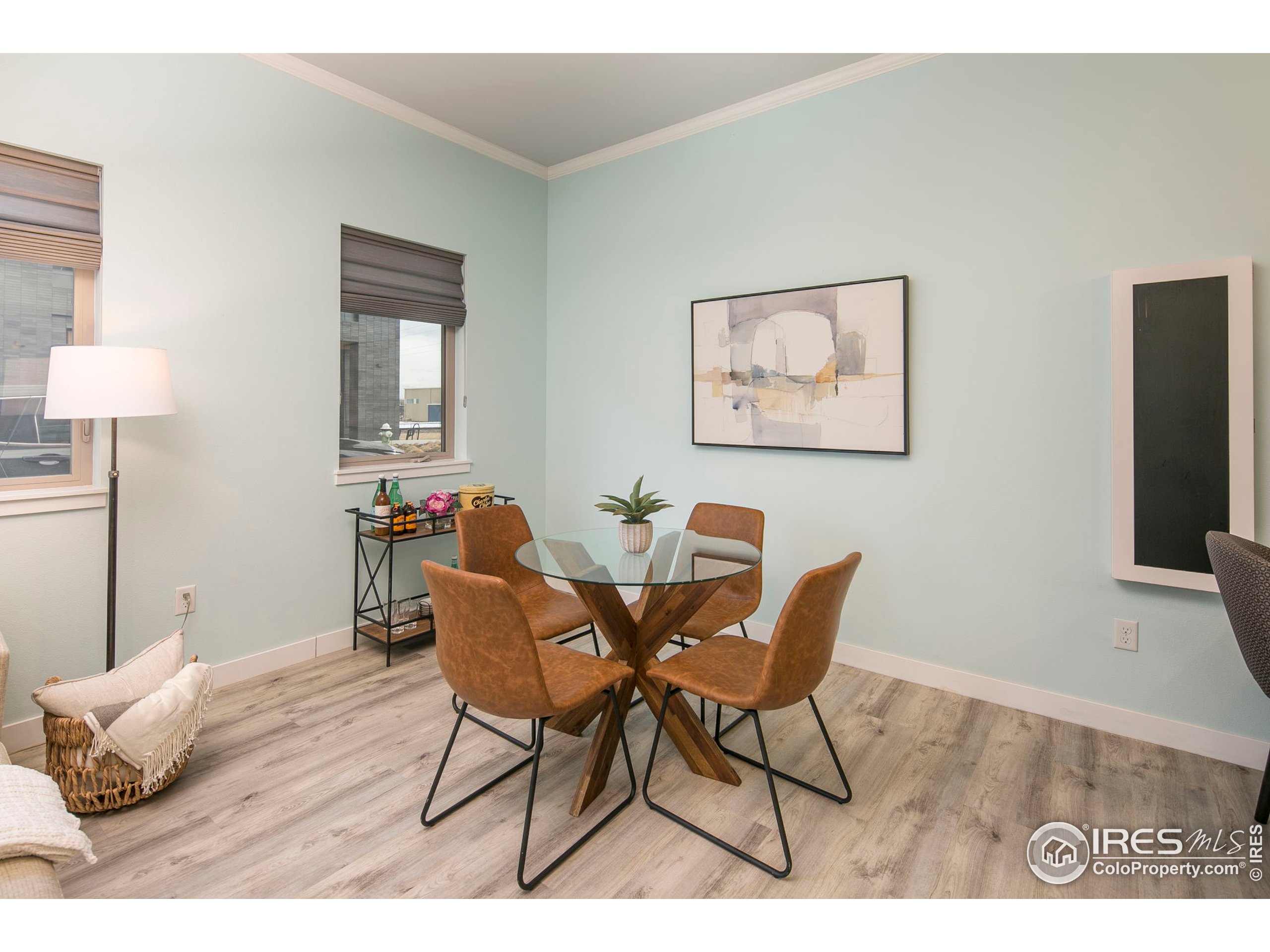 2445 Junction Place, Unit 103 Boulder, CO 80301 - Photo 11 of 29 a dining room with furniture and wooden floor