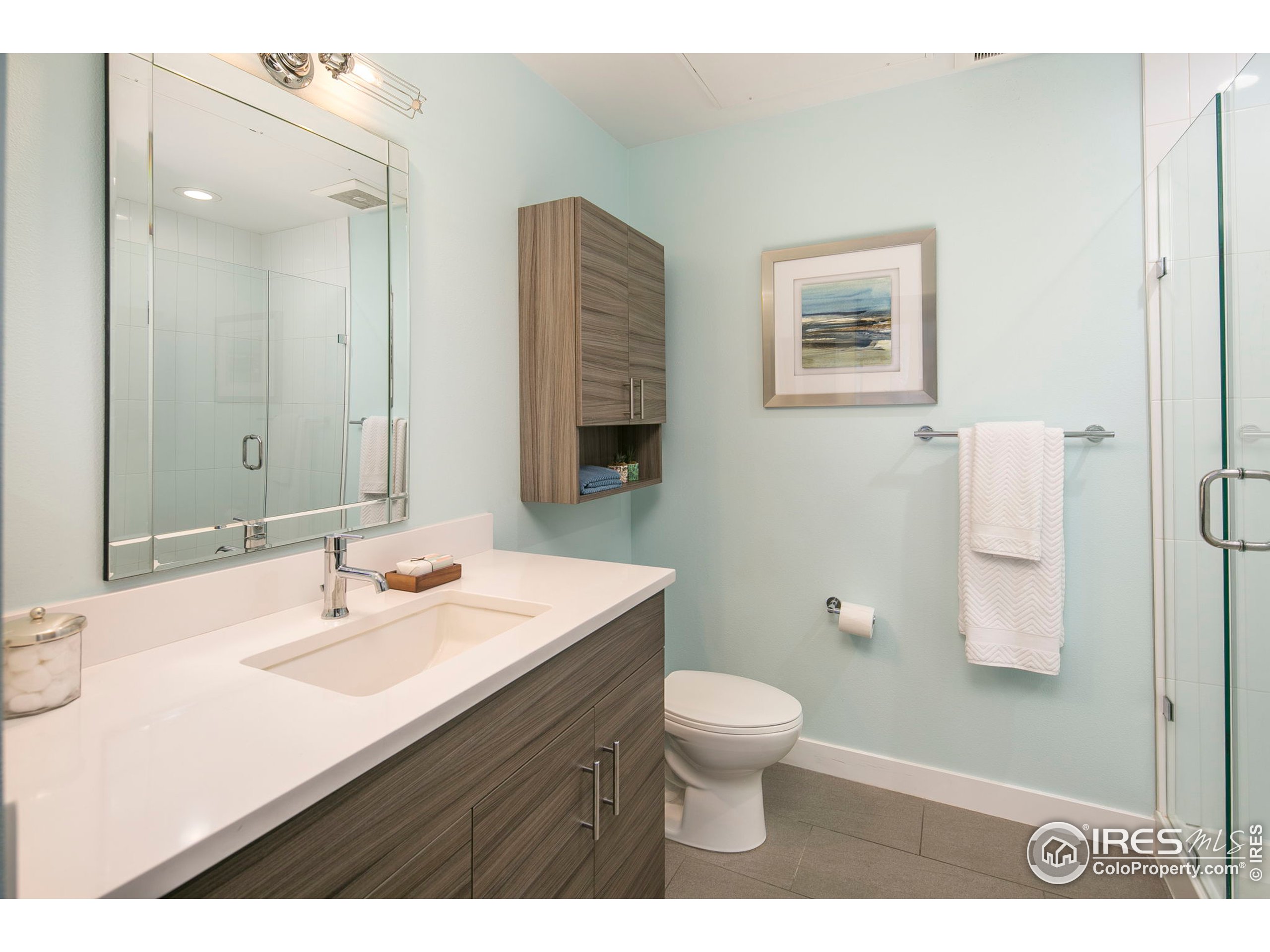 2445 Junction Place, Unit 103 Boulder, CO 80301 - Photo 12 of 29 a bathroom with a sink toilet and a mirror