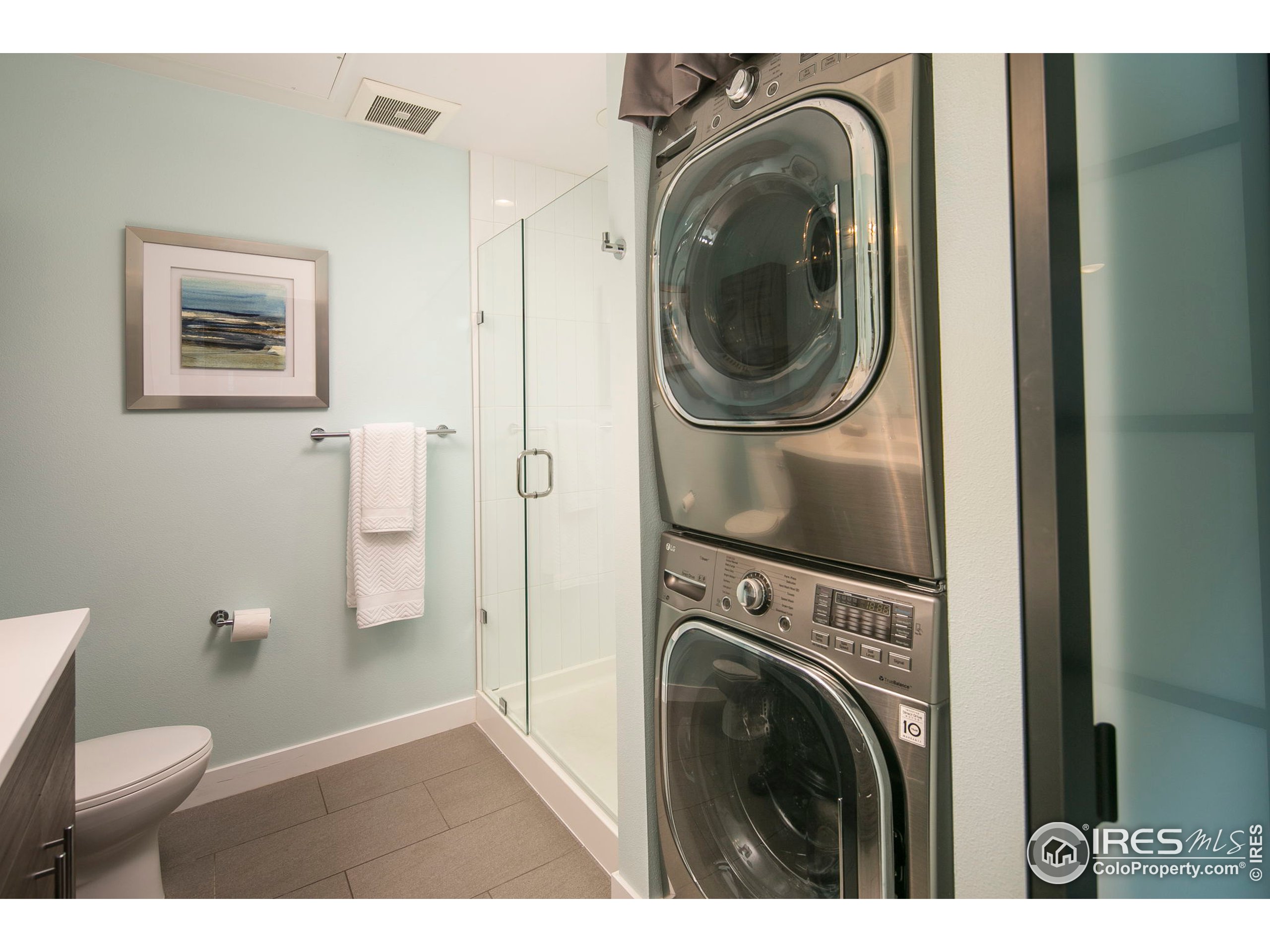 2445 Junction Place, Unit 103 Boulder, CO 80301 - Photo 13 of 29 a view of a hallway with washer and dryer