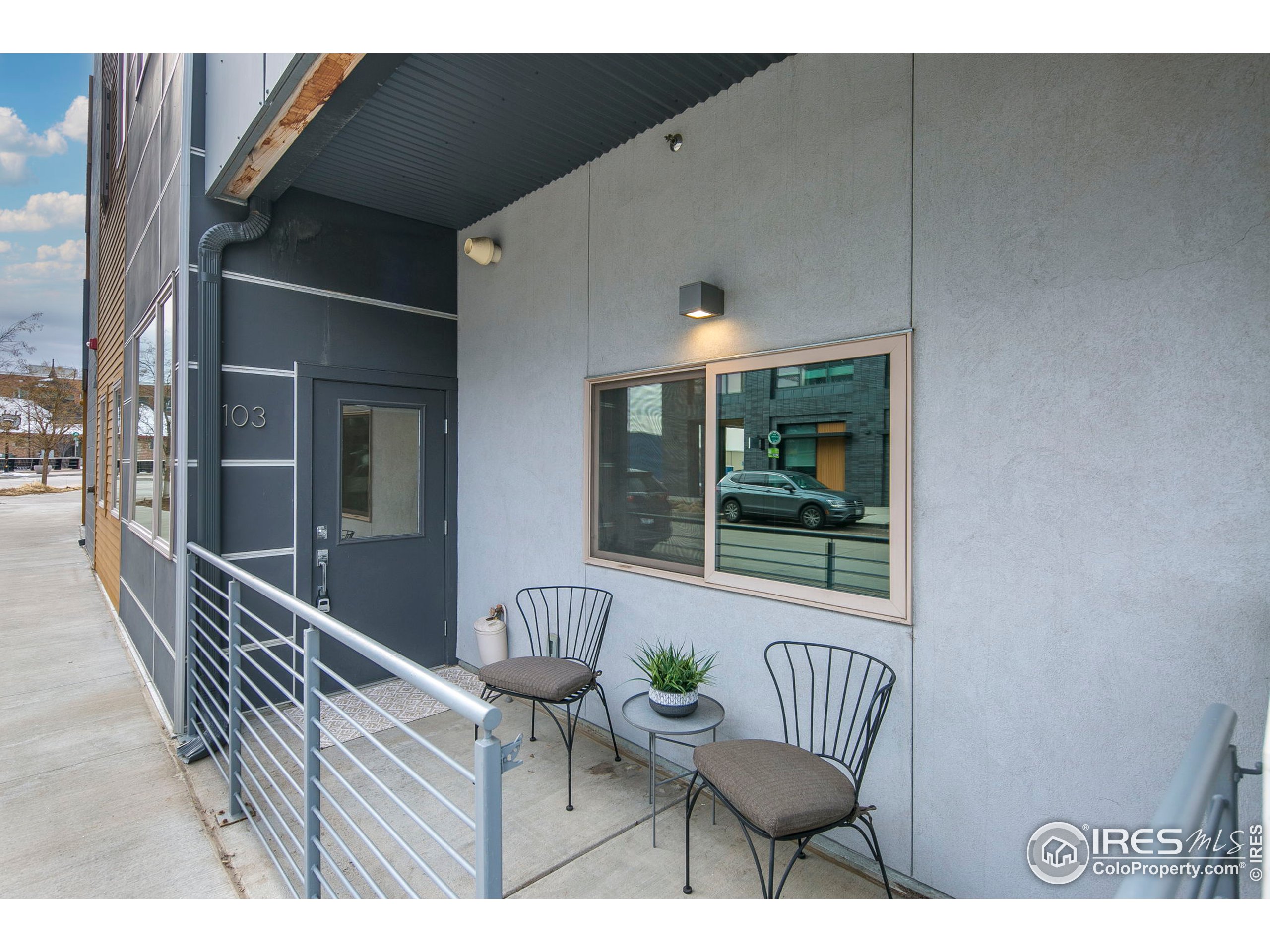 2445 Junction Place, Unit 103 Boulder, CO 80301 - Photo 2 of 29 a balcony with table and chairs
