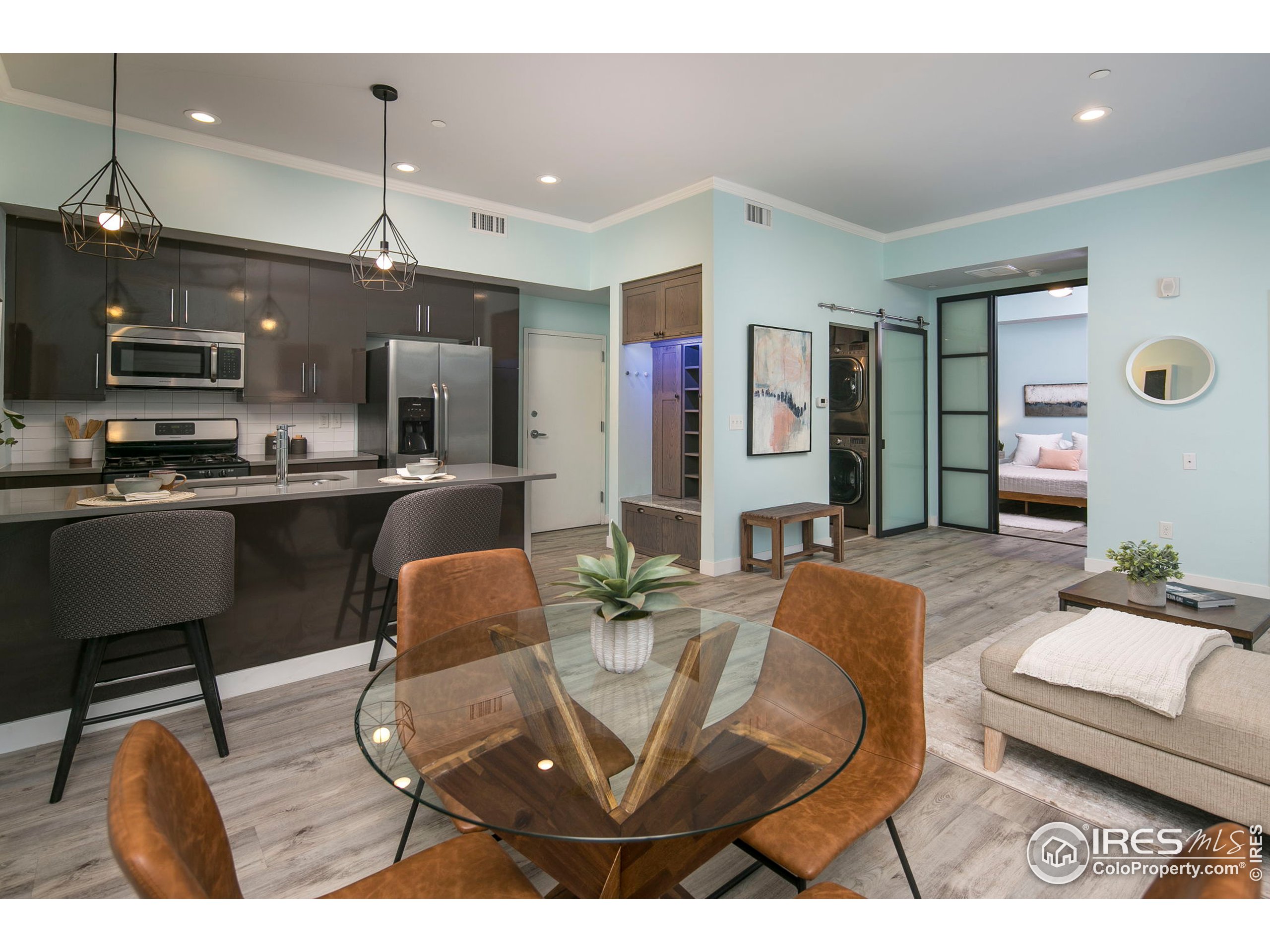 2445 Junction Place, Unit 103 Boulder, CO 80301 - Photo 4 of 29 a living room with stainless steel appliances kitchen island granite countertop furniture and a view of kitchen