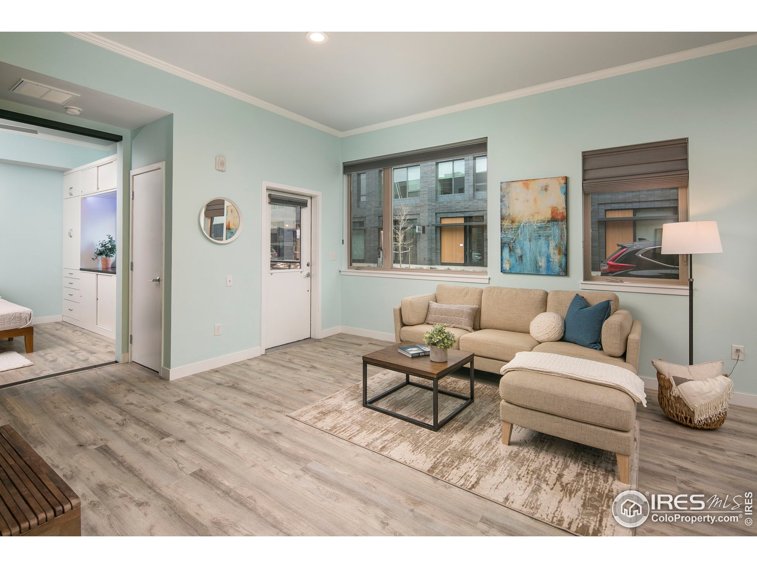 2445 Junction Place, Unit 103 Boulder, CO 80301 - Photo 9 of 29 a living room with furniture and large window