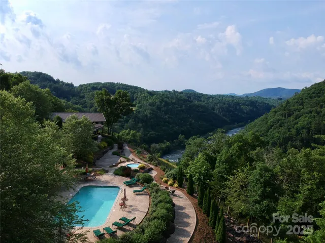 an aerial view of a house with mountain view