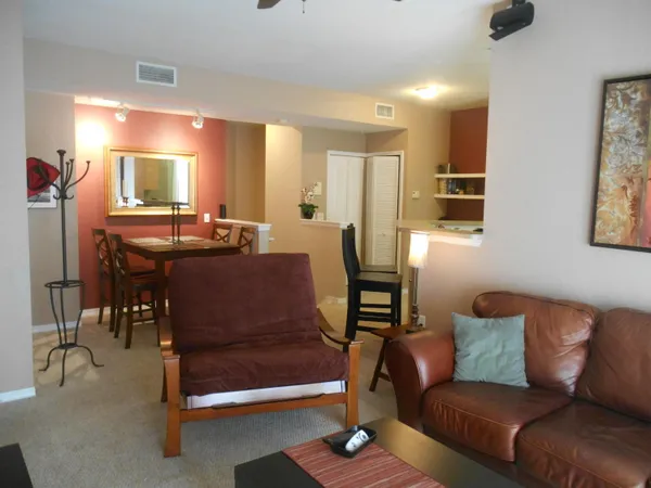 a living room with furniture and a table