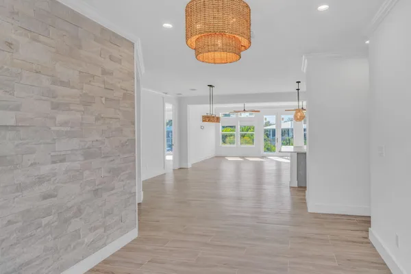 a kitchen with stainless steel appliances granite countertop a sink a stove a refrigerator and center island