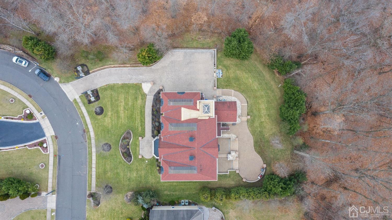 8 Madden Court Edison, NJ 08820 - Photo 2 of 75 an aerial view of a house with outdoor space and a lake view