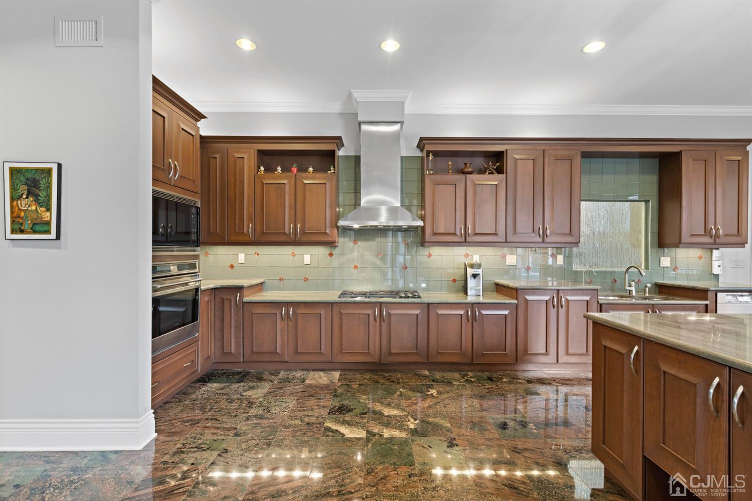 8 Madden Court Edison, NJ 08820 - Photo 14 of 75 a kitchen with stainless steel appliances granite countertop a stove sink and cabinets