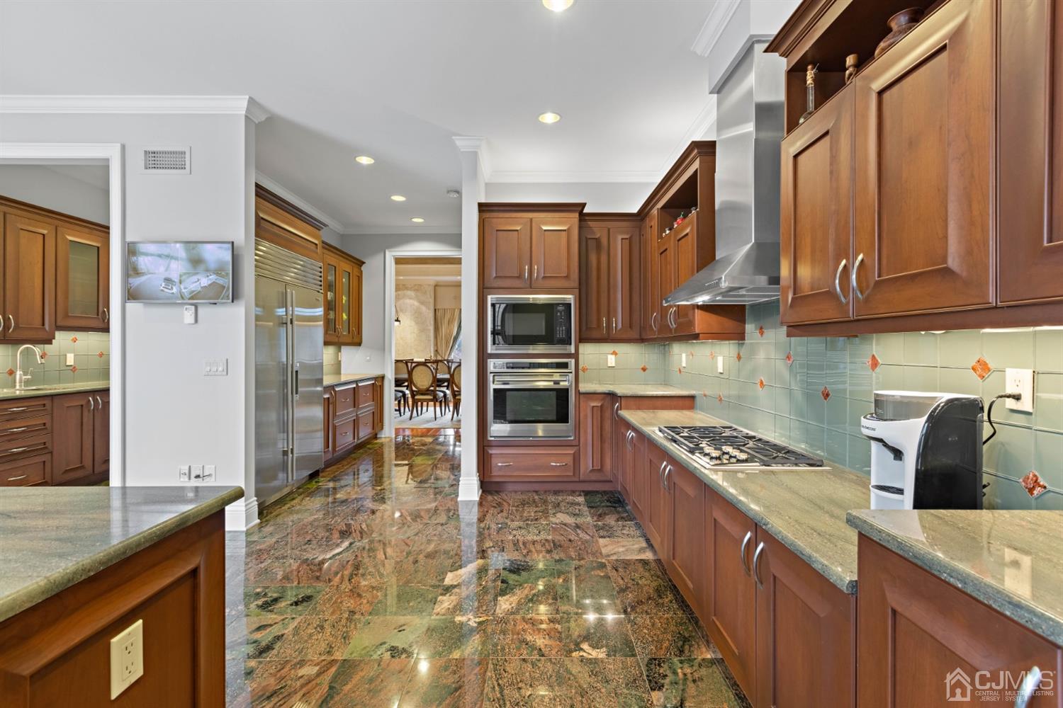 8 Madden Court Edison, NJ 08820 - Photo 19 of 75 a kitchen with stainless steel appliances granite countertop a stove refrigerator sink and cabinets