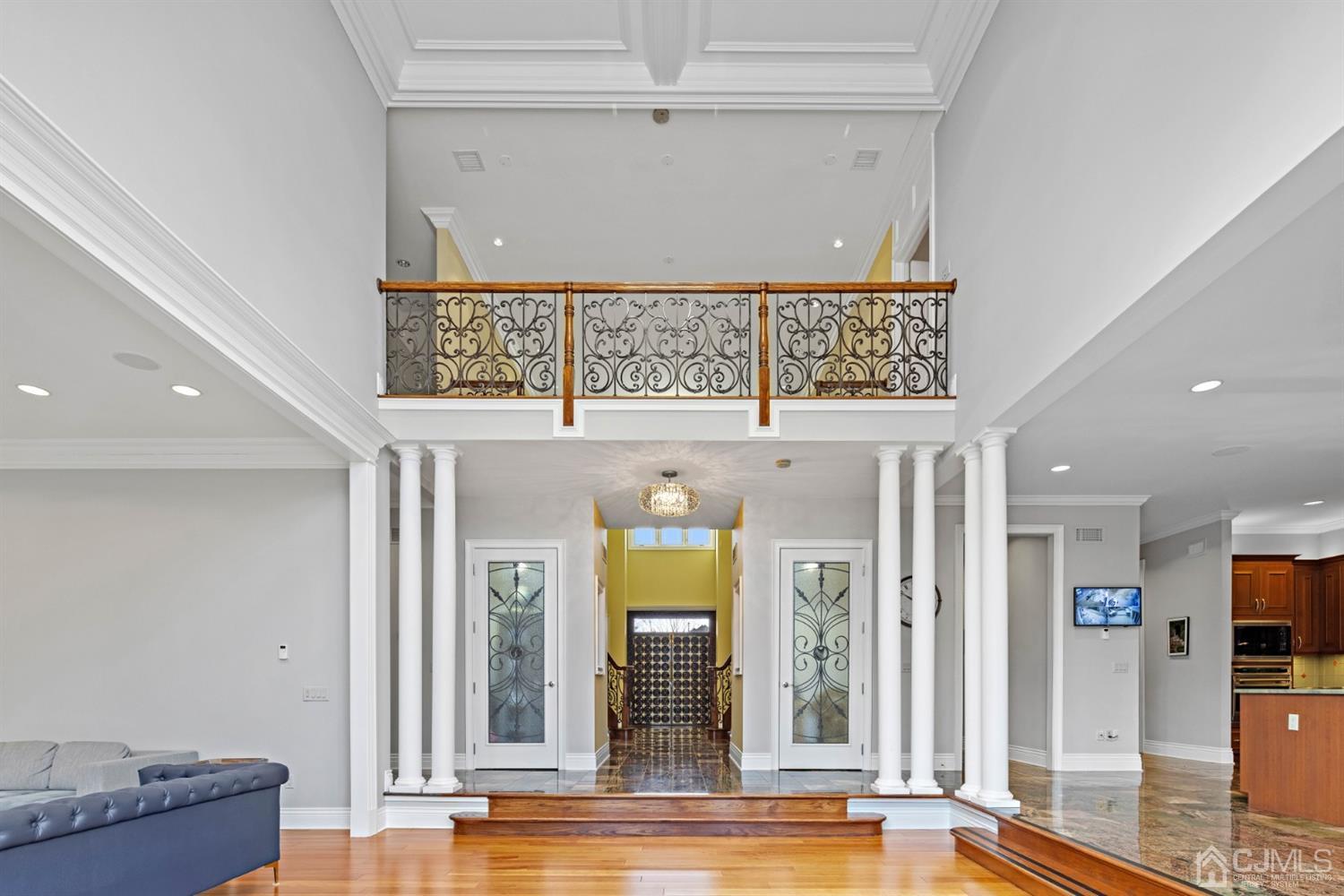 8 Madden Court Edison, NJ 08820 - Photo 25 of 75 a view of a hallway with wooden floor and windows