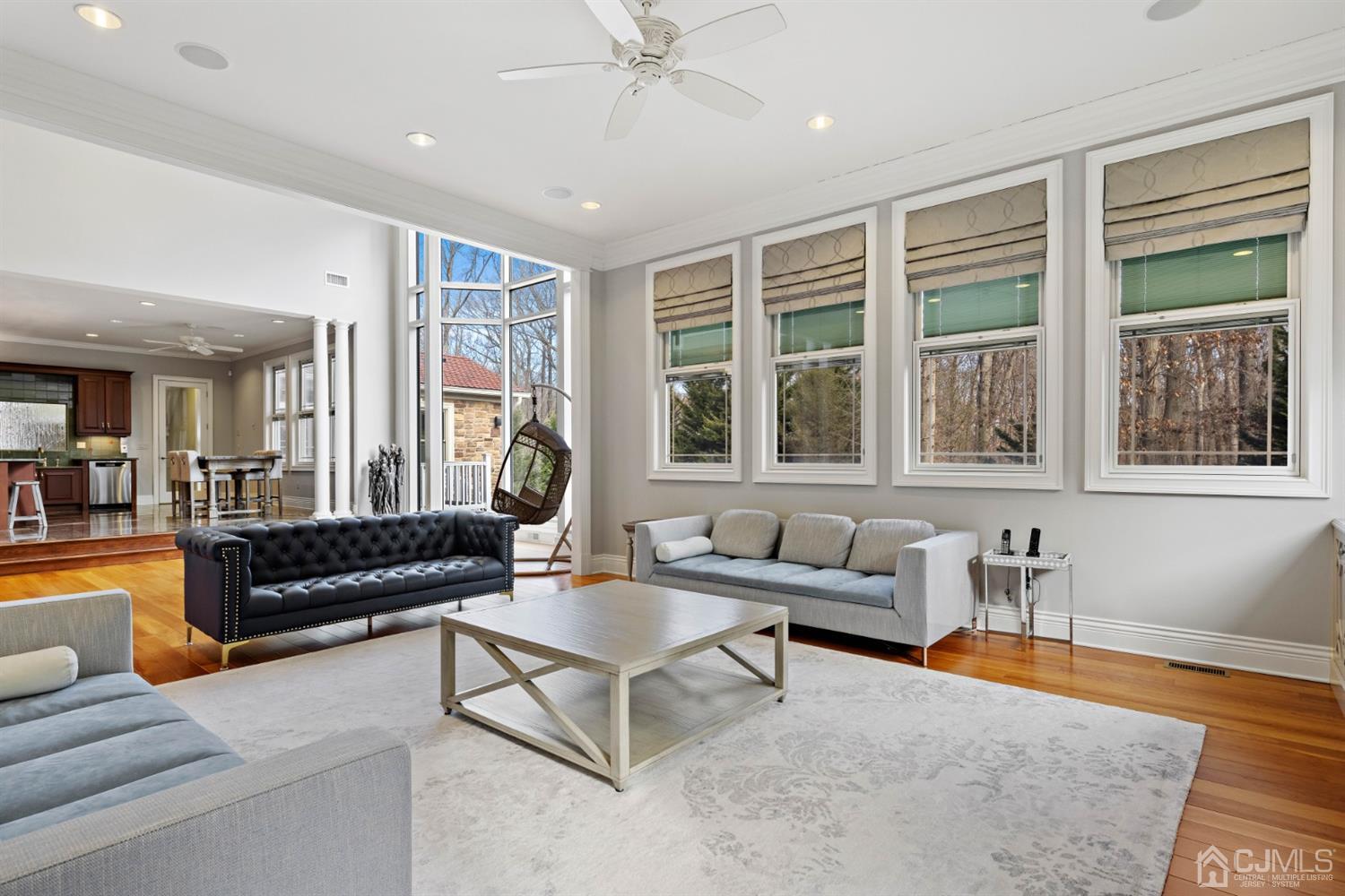 8 Madden Court Edison, NJ 08820 - Photo 29 of 75 a living room with furniture and floor to ceiling windows