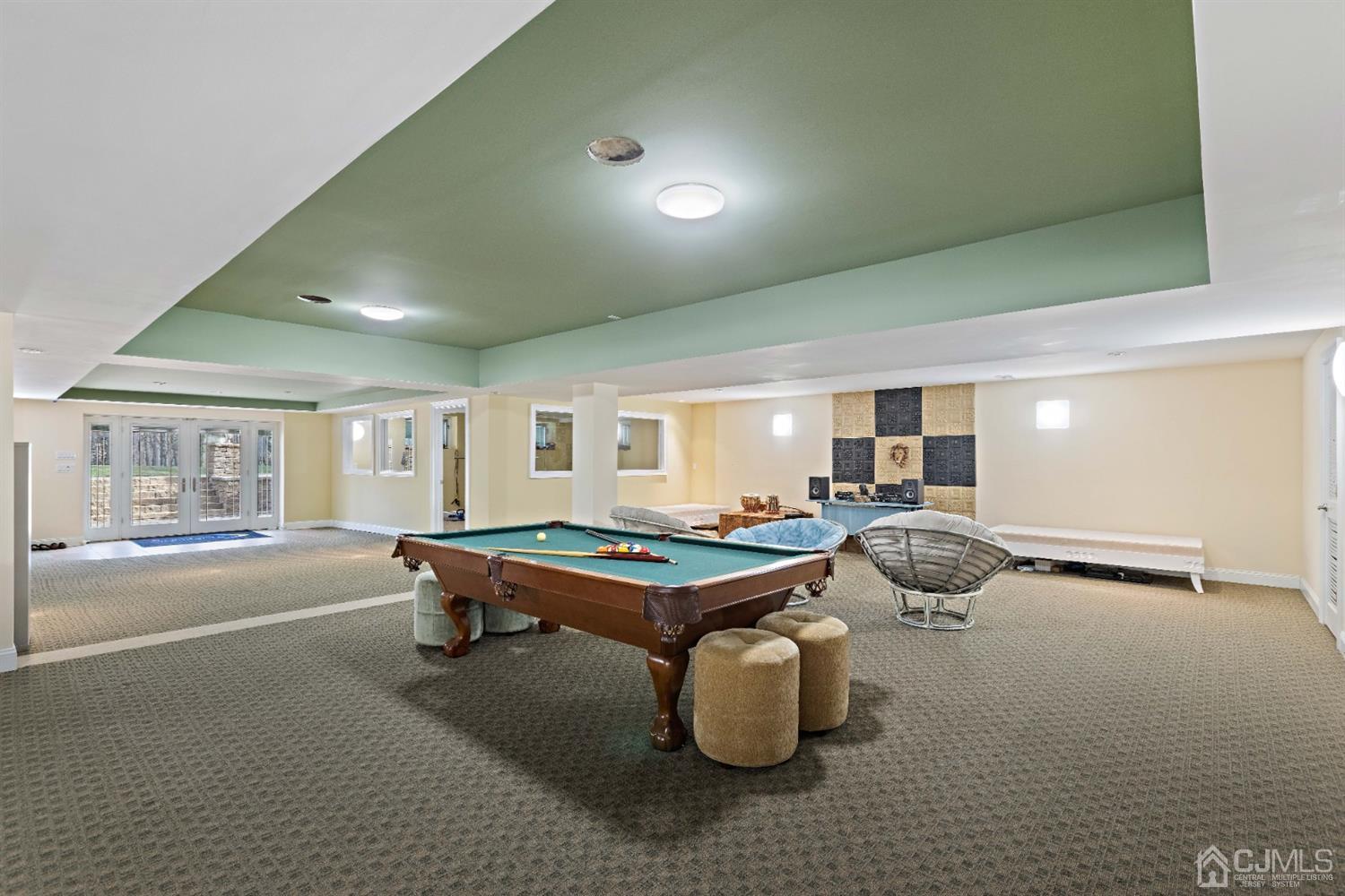 8 Madden Court Edison, NJ 08820 - Photo 46 of 75 a dining room with furniture and a flat screen tv