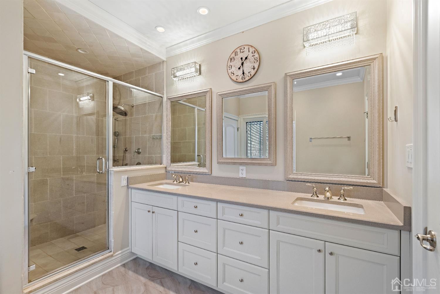 8 Madden Court Edison, NJ 08820 - Photo 65 of 75 a bathroom with a sink and a mirror