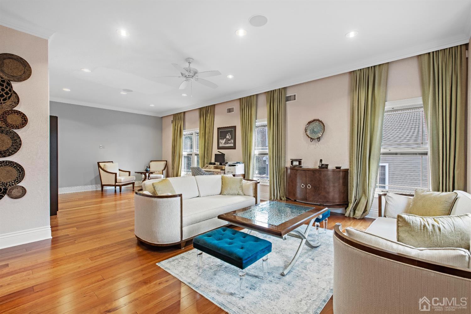 8 Madden Court Edison, NJ 08820 - Photo 8 of 75 a living room with furniture and wooden floor