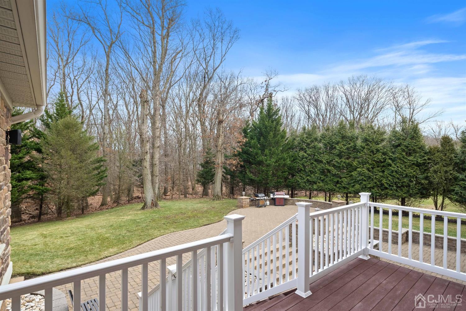 8 Madden Court Edison, NJ 08820 - Photo 74 of 75 a view of a wooden deck and yard with trees in the background