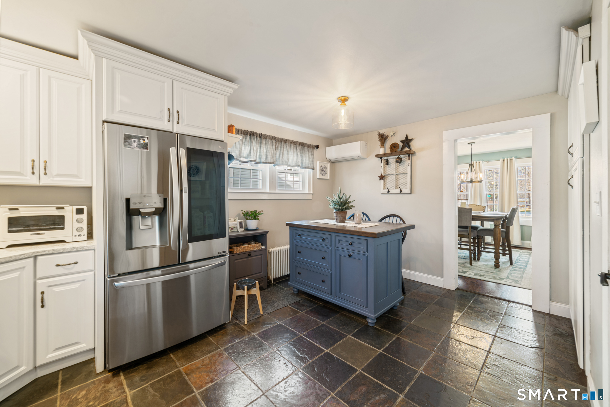 101 Vincent Road Bristol, CT 06010 - Photo 15 of 37 a kitchen with granite countertop a refrigerator and a stove top oven