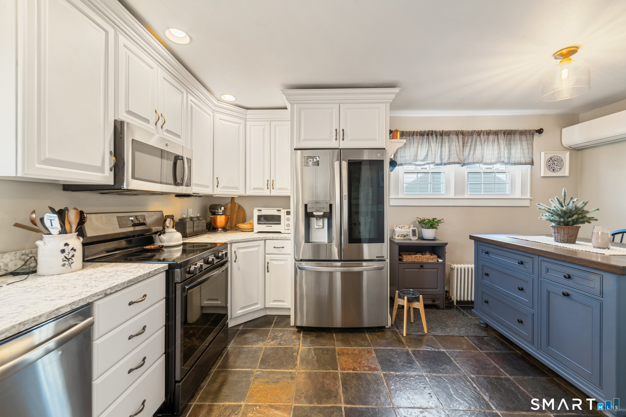 101 Vincent Road Bristol, CT 06010 - Photo 16 of 37 a kitchen with stainless steel appliances granite countertop a refrigerator sink and cabinets