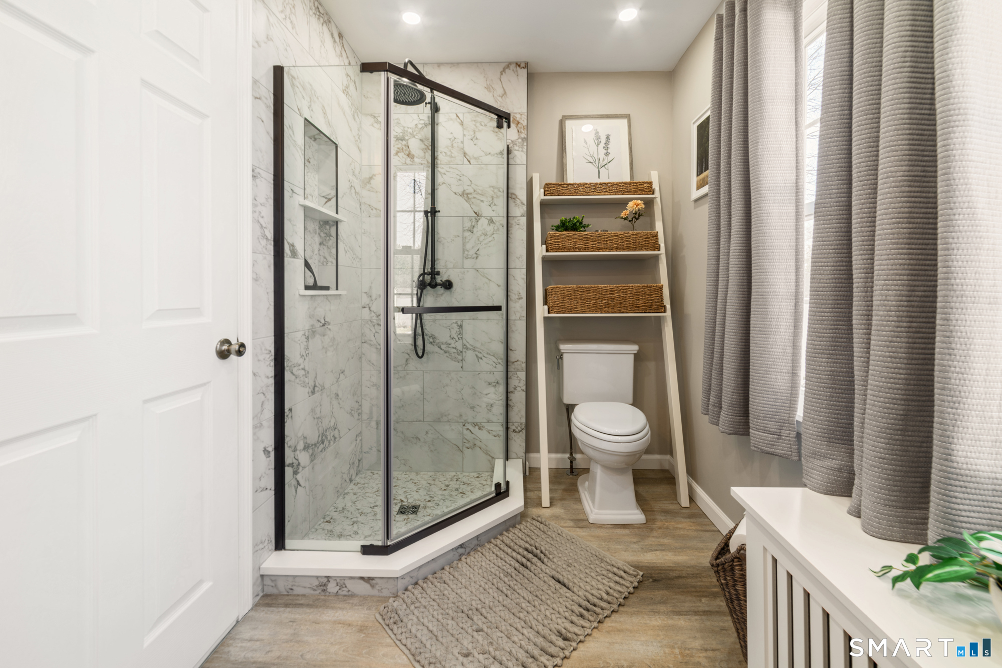 101 Vincent Road Bristol, CT 06010 - Photo 17 of 37 a bathroom with a granite countertop shower a toilet and a sink