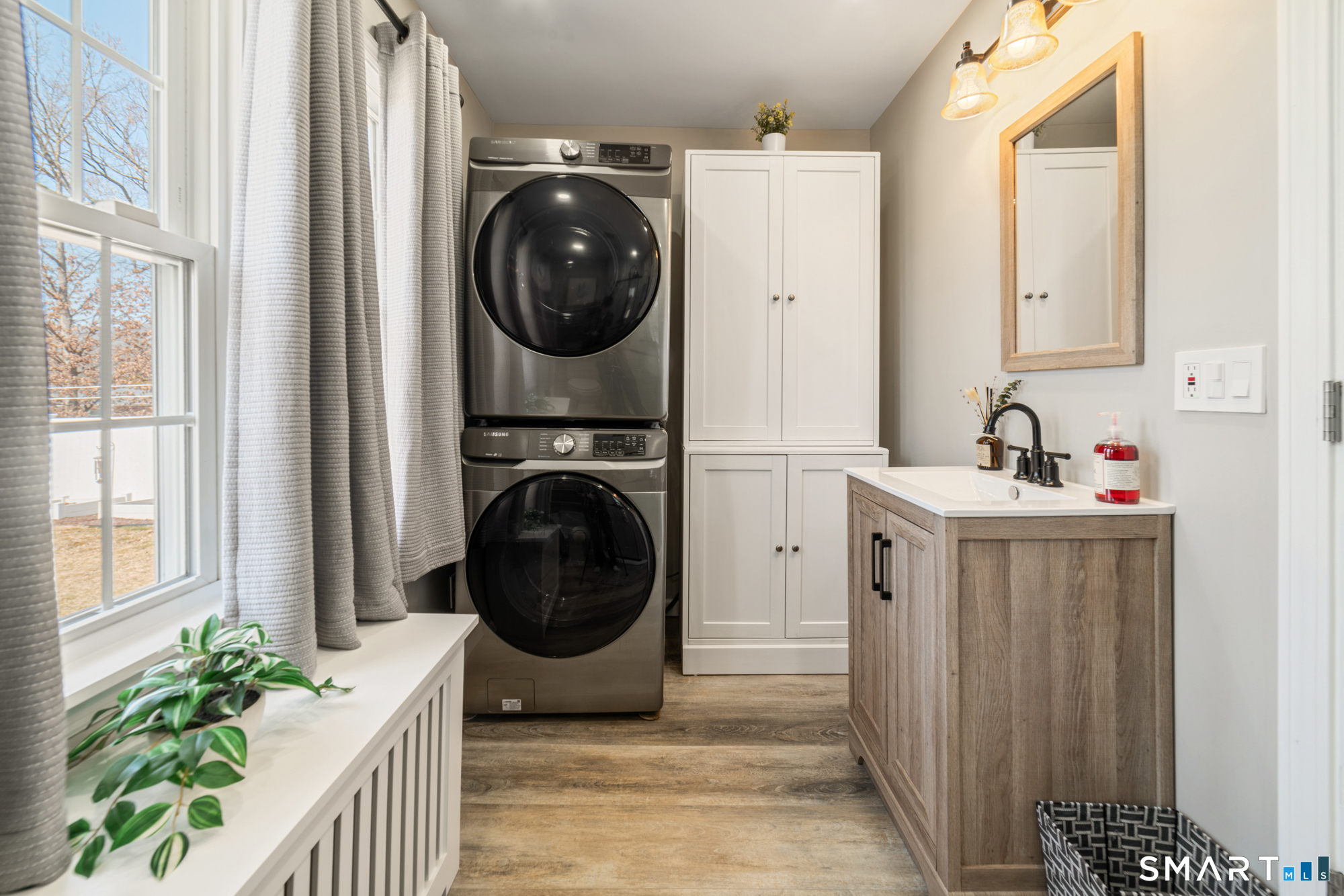 101 Vincent Road Bristol, CT 06010 - Photo 19 of 37 a utility room with sink dryer and washer