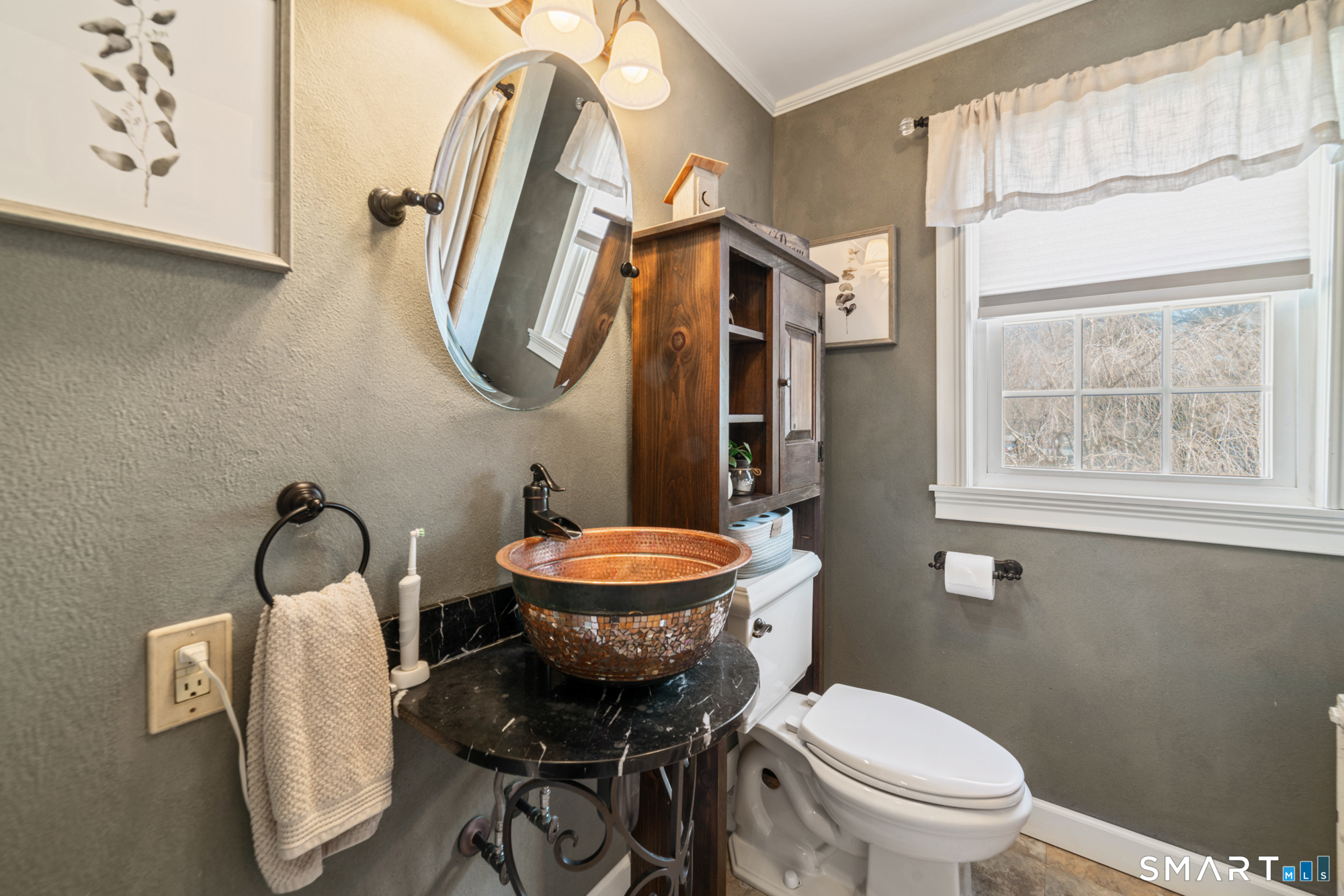 101 Vincent Road Bristol, CT 06010 - Photo 26 of 37 a bathroom with a toilet a sink and a mirror