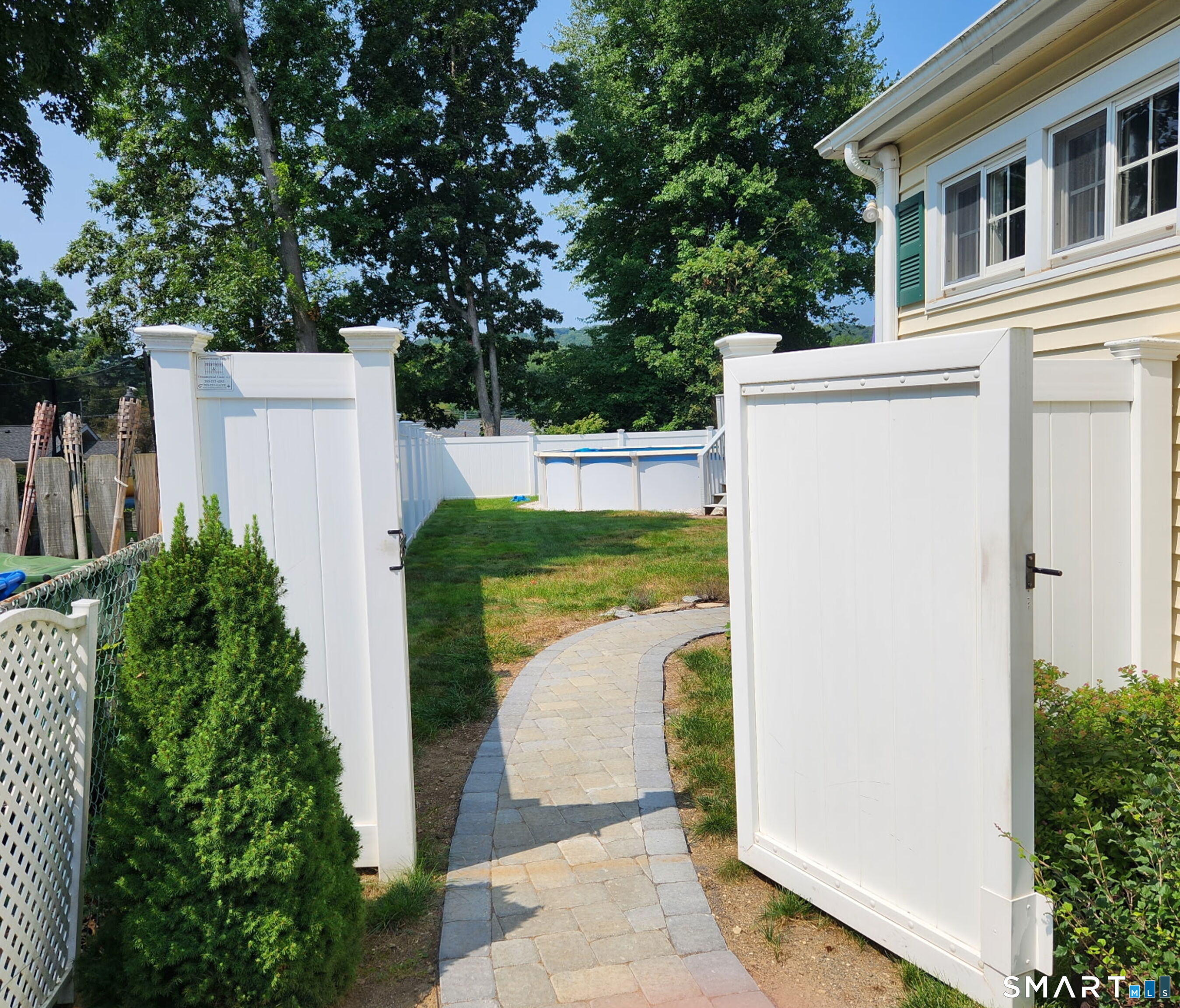 101 Vincent Road Bristol, CT 06010 - Photo 29 of 37 a view of a house with a small yard and a large tree