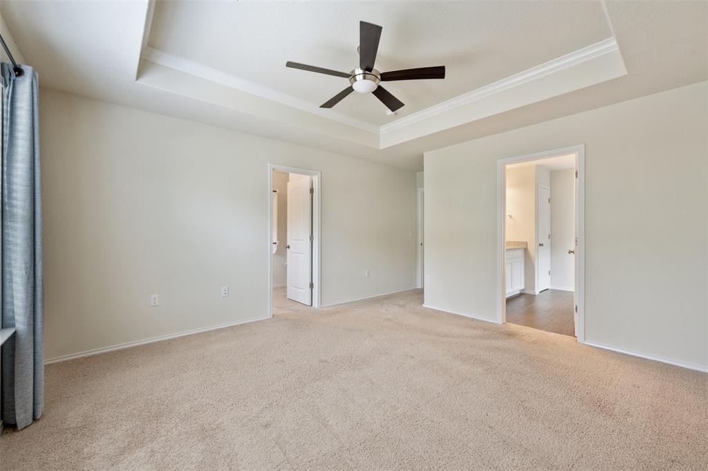 10612 Turnbull Loop, Unit 30 Austin, TX 78717 - Photo 18 of 30 a view of an empty room and a ceiling fan