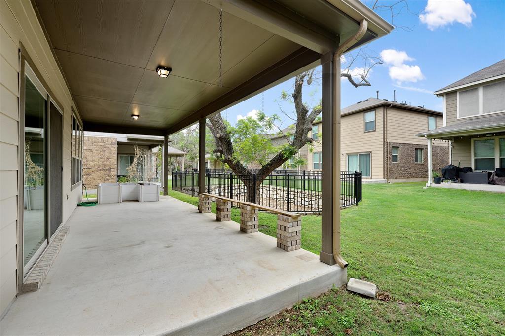 10612 Turnbull Loop, Unit 30 Austin, TX 78717 - Photo 23 of 30 a view of a house with backyard and porch