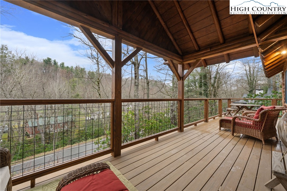 1520 Bamboo Road Boone, NC 28607 - Photo 4 of 41 a view of a balcony with furniture and wooden floor