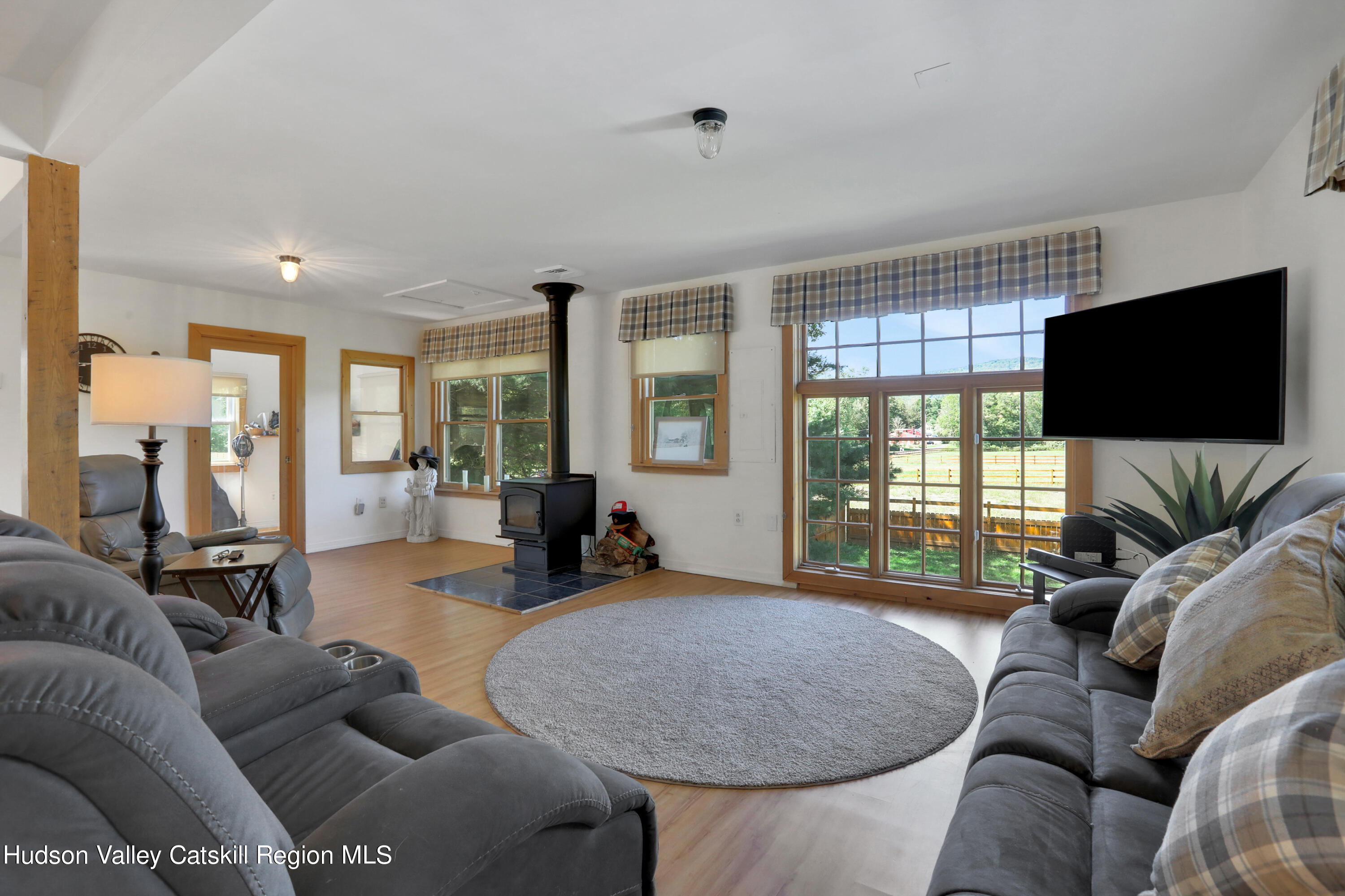 1 Dug Road New Paltz, NY 12561 - Photo 11 of 26 a living room with furniture and a flat screen tv
