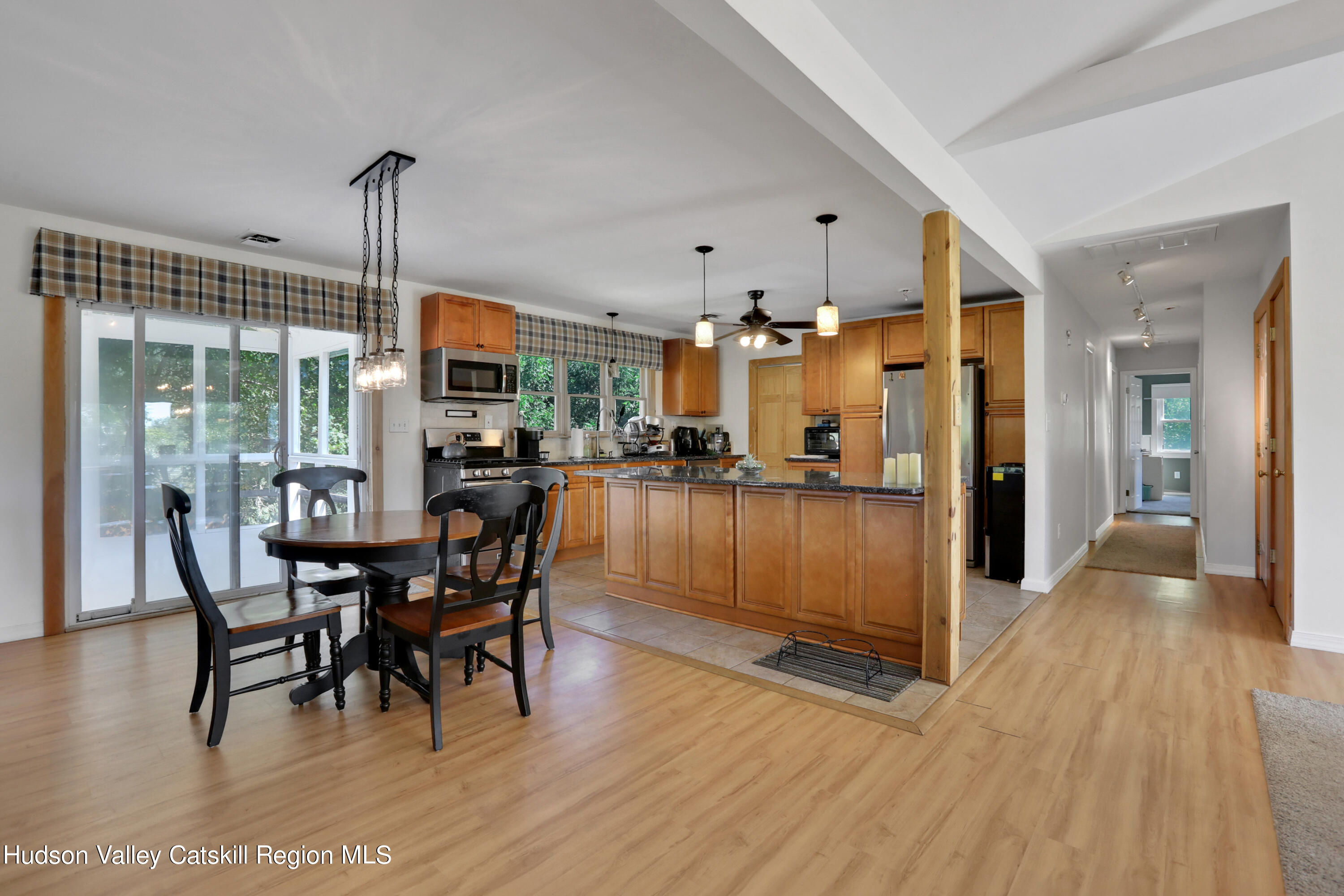 1 Dug Road New Paltz, NY 12561 - Photo 12 of 26 a view of a dining room and livingroom with furniture wooden floor a chandelier
