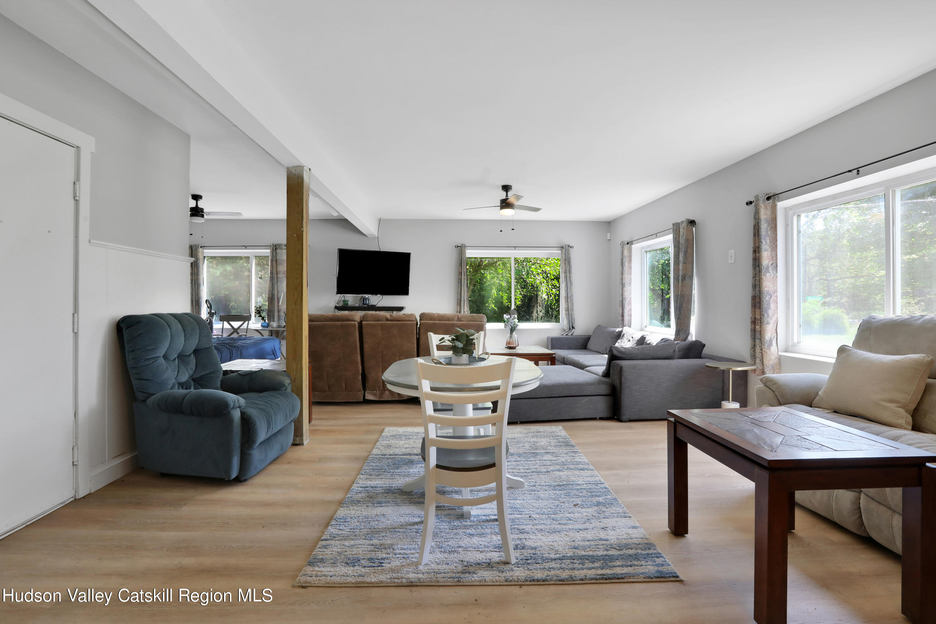 1 Dug Road New Paltz, NY 12561 - Photo 14 of 26 a living room with furniture a large window and a fireplace