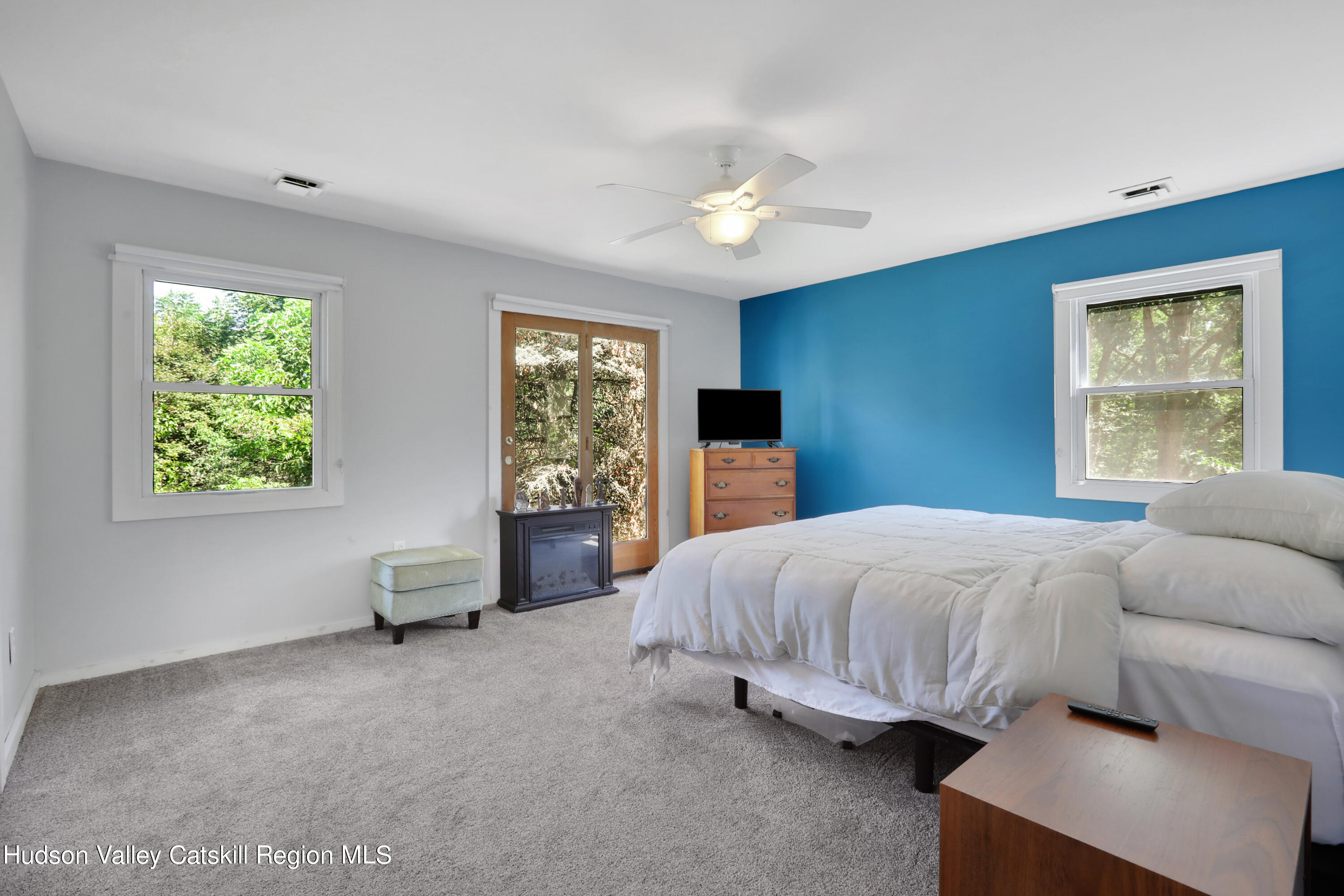 1 Dug Road New Paltz, NY 12561 - Photo 15 of 26 a spacious bedroom with a large bed and a window