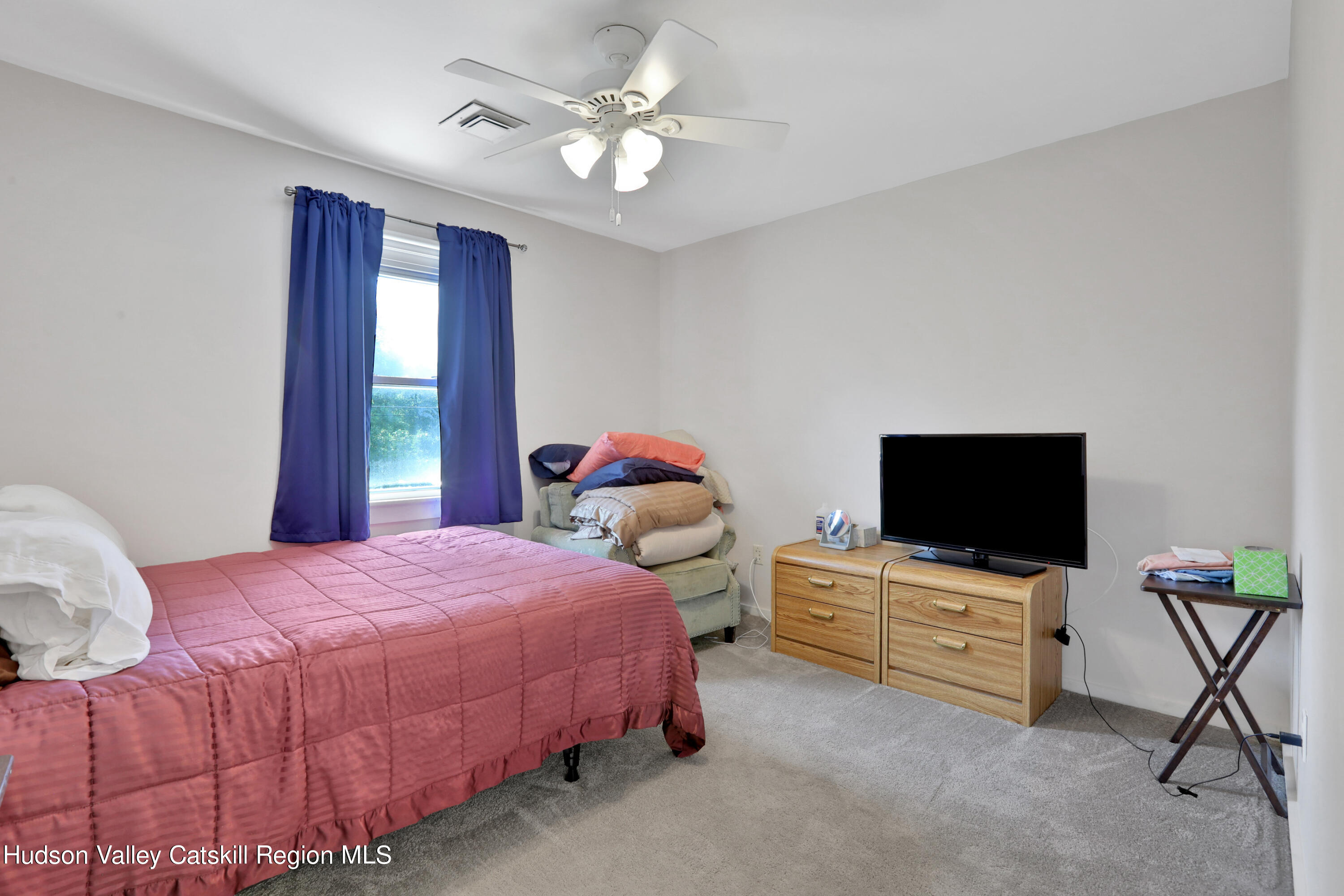 1 Dug Road New Paltz, NY 12561 - Photo 17 of 26 a bedroom with a bed and tv