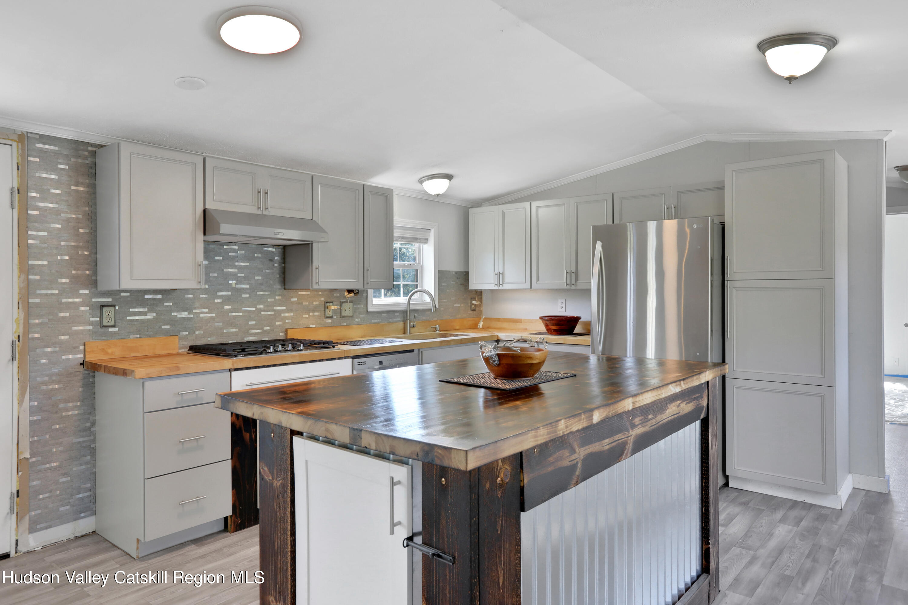 1 Dug Road New Paltz, NY 12561 - Photo 22 of 26 a kitchen with stainless steel appliances granite countertop a sink stove and refrigerator
