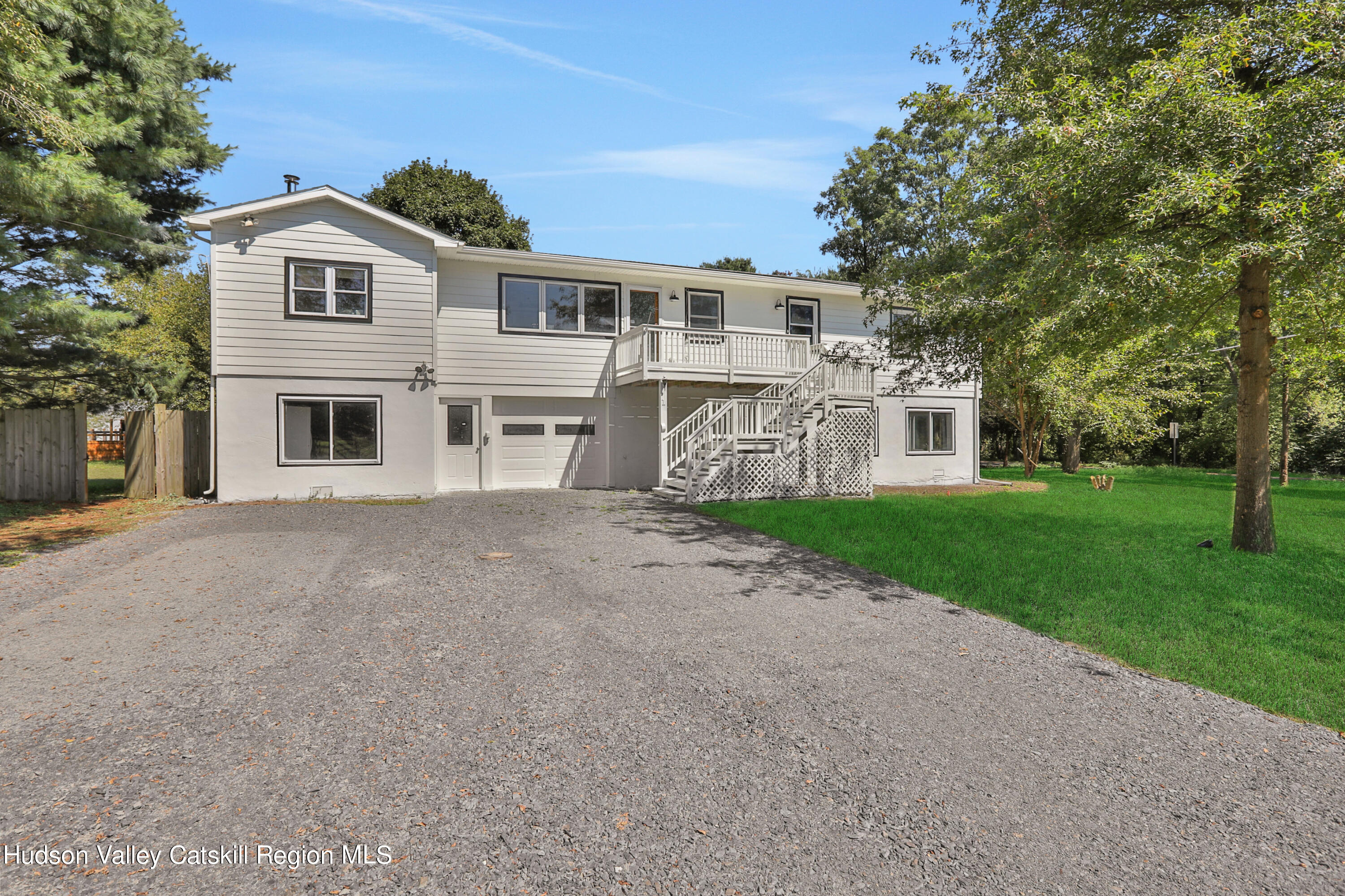 1 Dug Road New Paltz, NY 12561 - Photo 4 of 26 a front view of a house with garden and trees