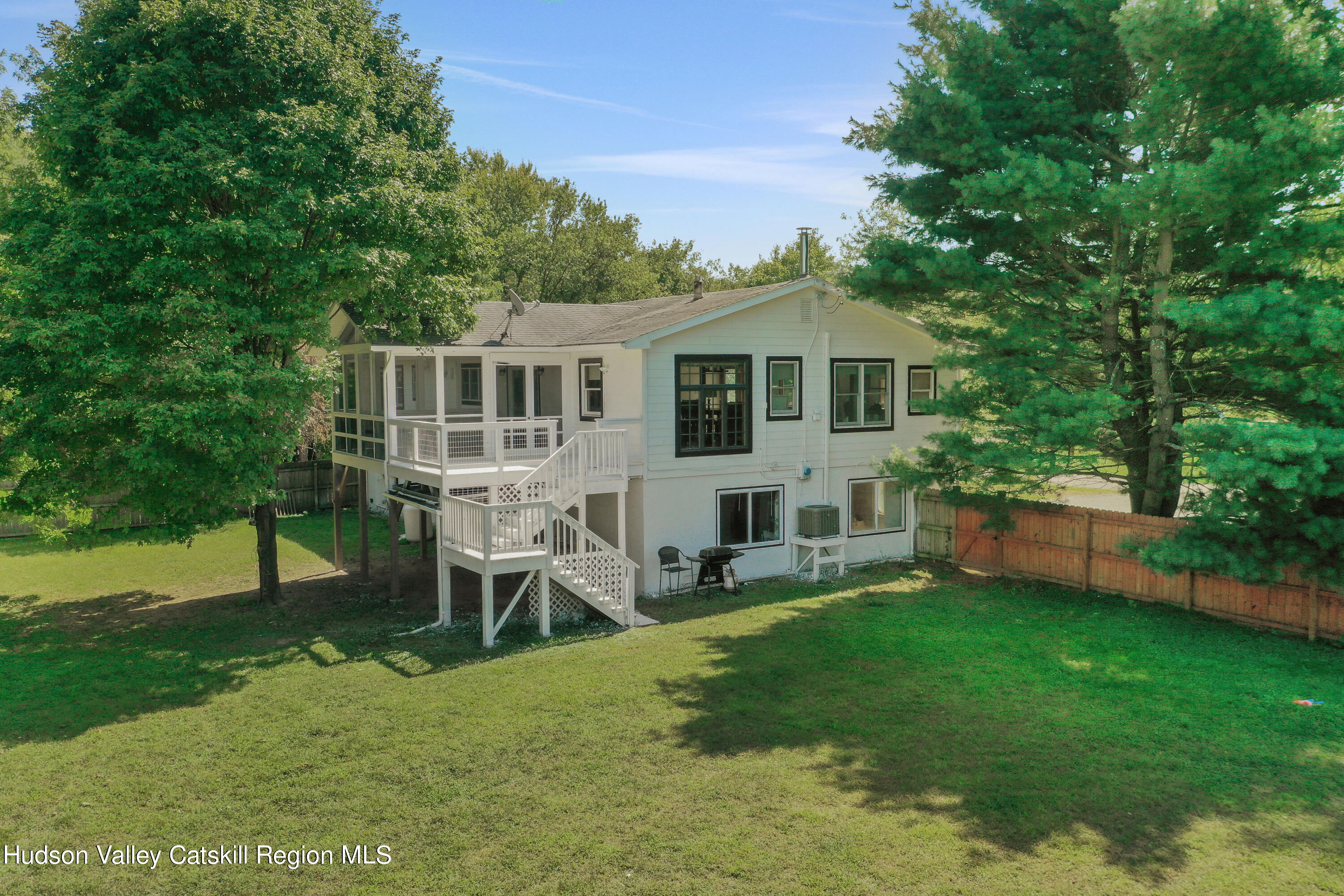 1 Dug Road New Paltz, NY 12561 - Photo 5 of 26 a view of a house with a backyard and a patio