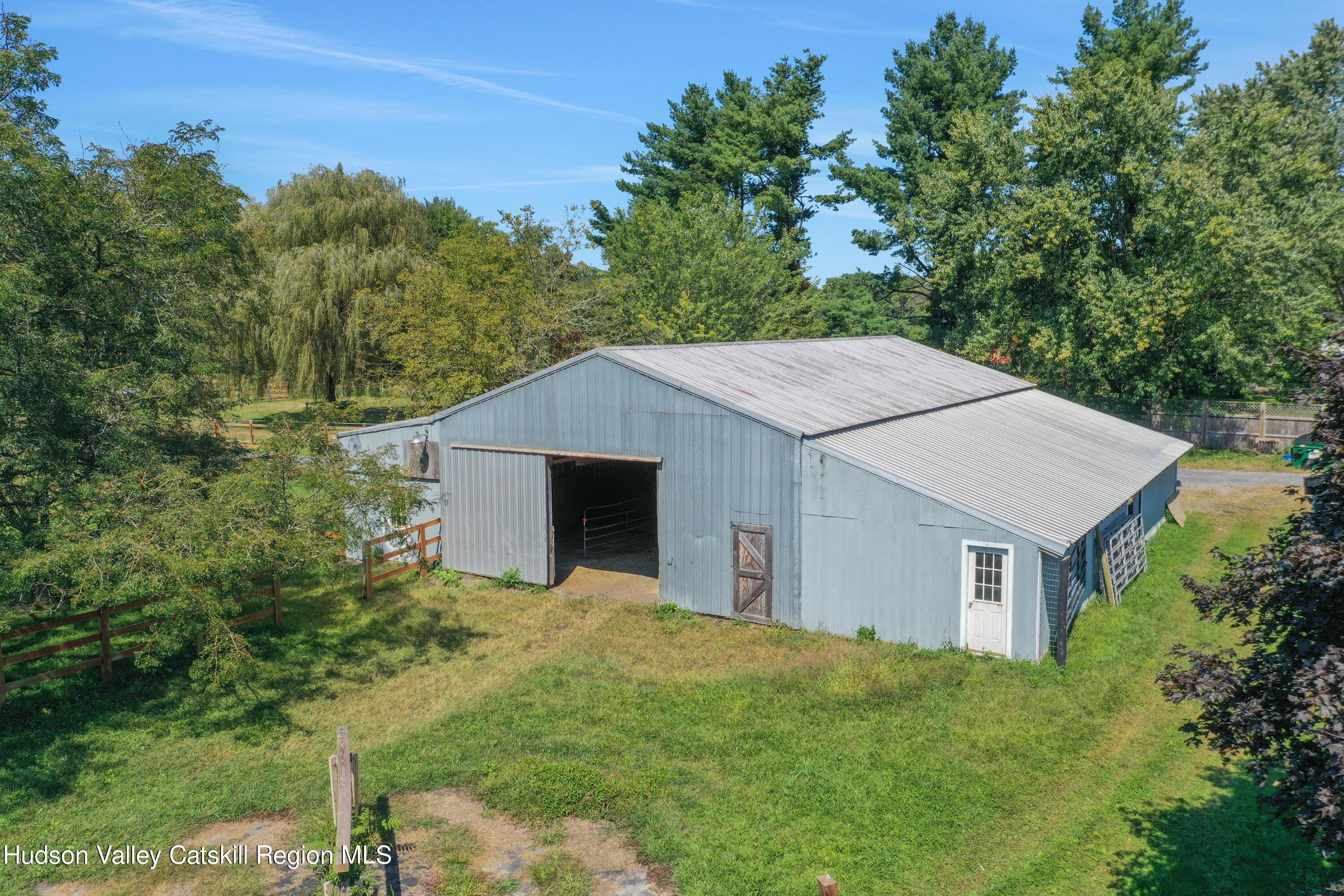 1 Dug Road New Paltz, NY 12561 - Photo 6 of 26 a aerial view of a house with yard and trees in the background