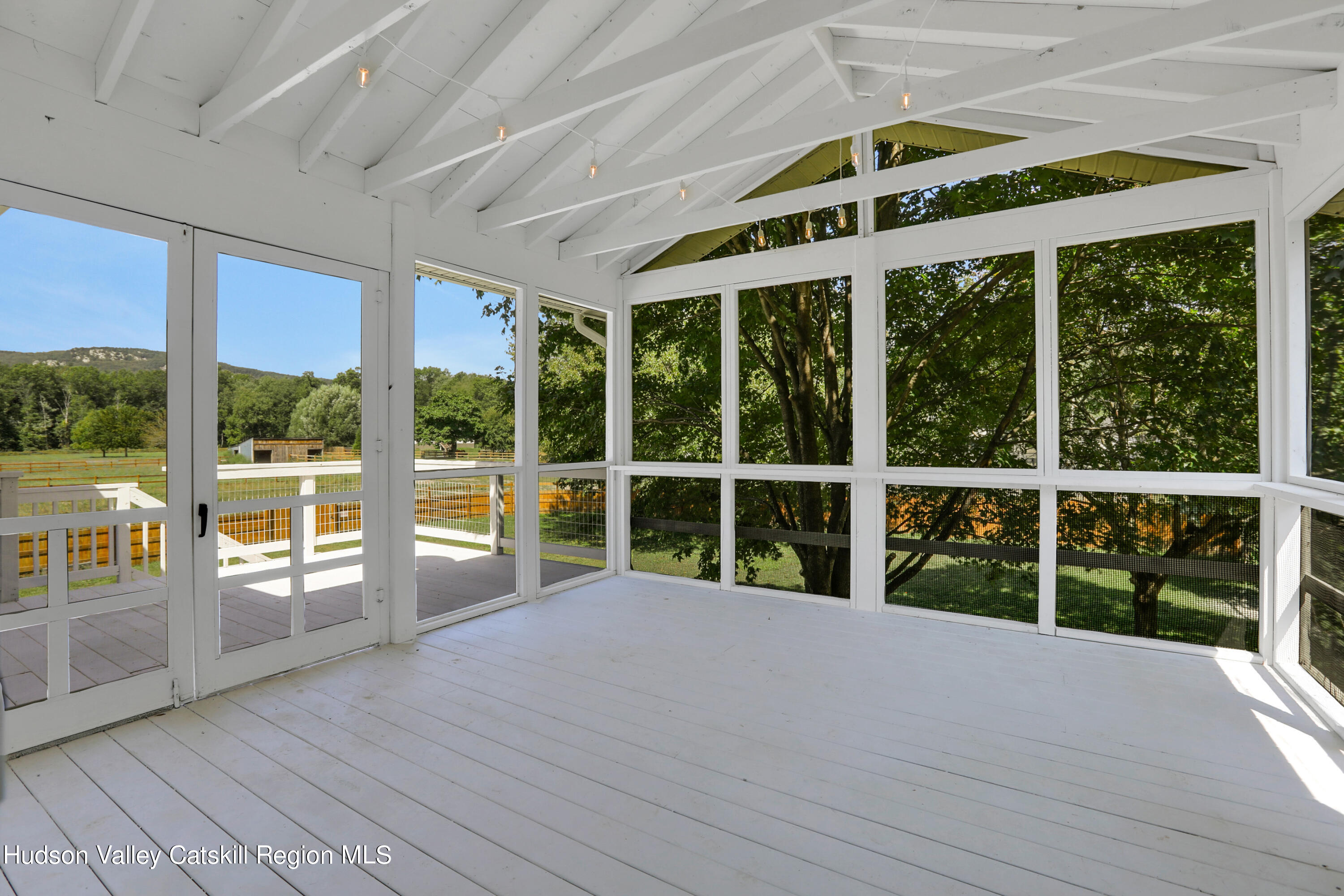 1 Dug Road New Paltz, NY 12561 - Photo 9 of 26 a view of an empty room with wooden floor and windows