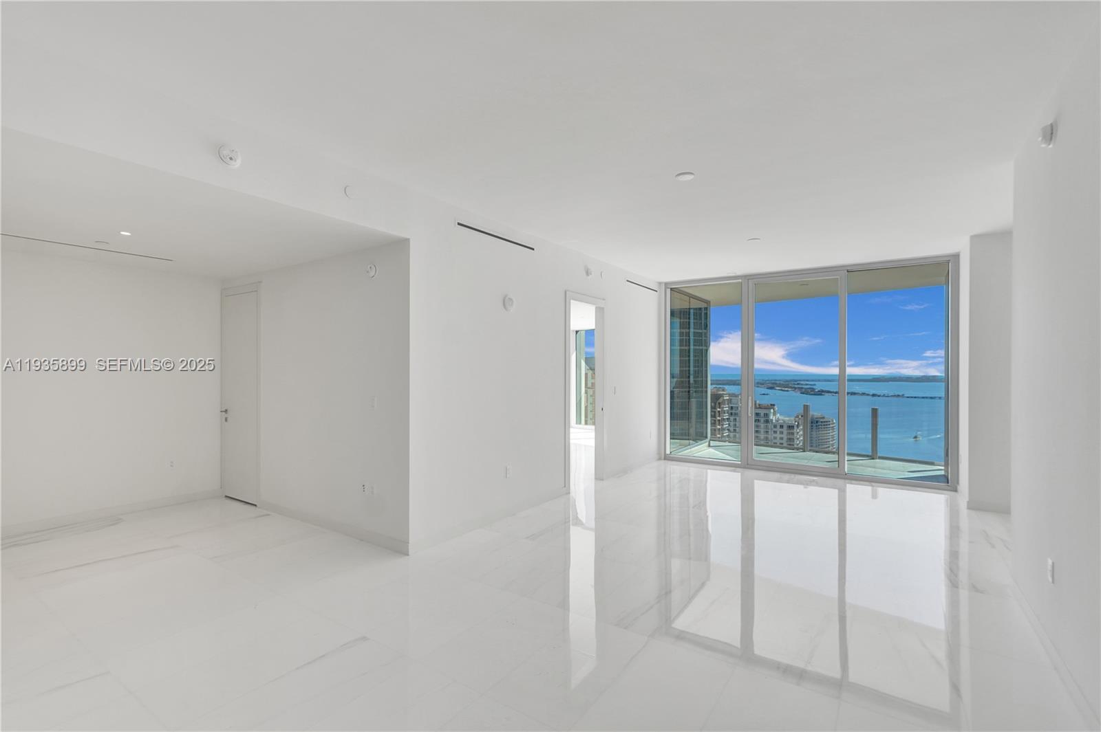 300 Biscayne Blvd Way, Unit 3605W Miami, FL 33131 - Photo 12 of 65 wooden floor in an empty room with a window