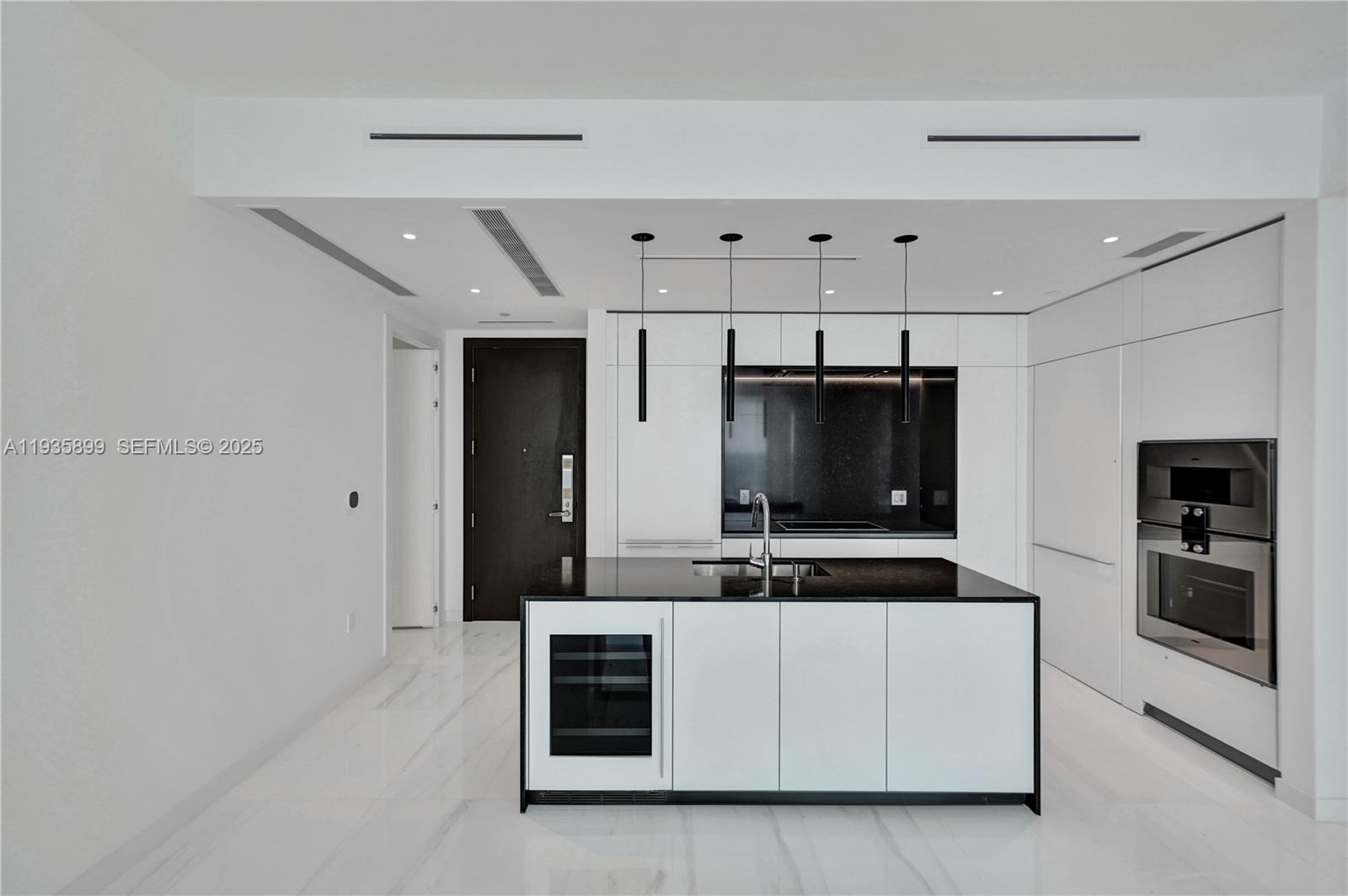 300 Biscayne Blvd Way, Unit 3605W Miami, FL 33131 - Photo 22 of 65 a kitchen with stainless steel appliances a refrigerator and a stove top oven