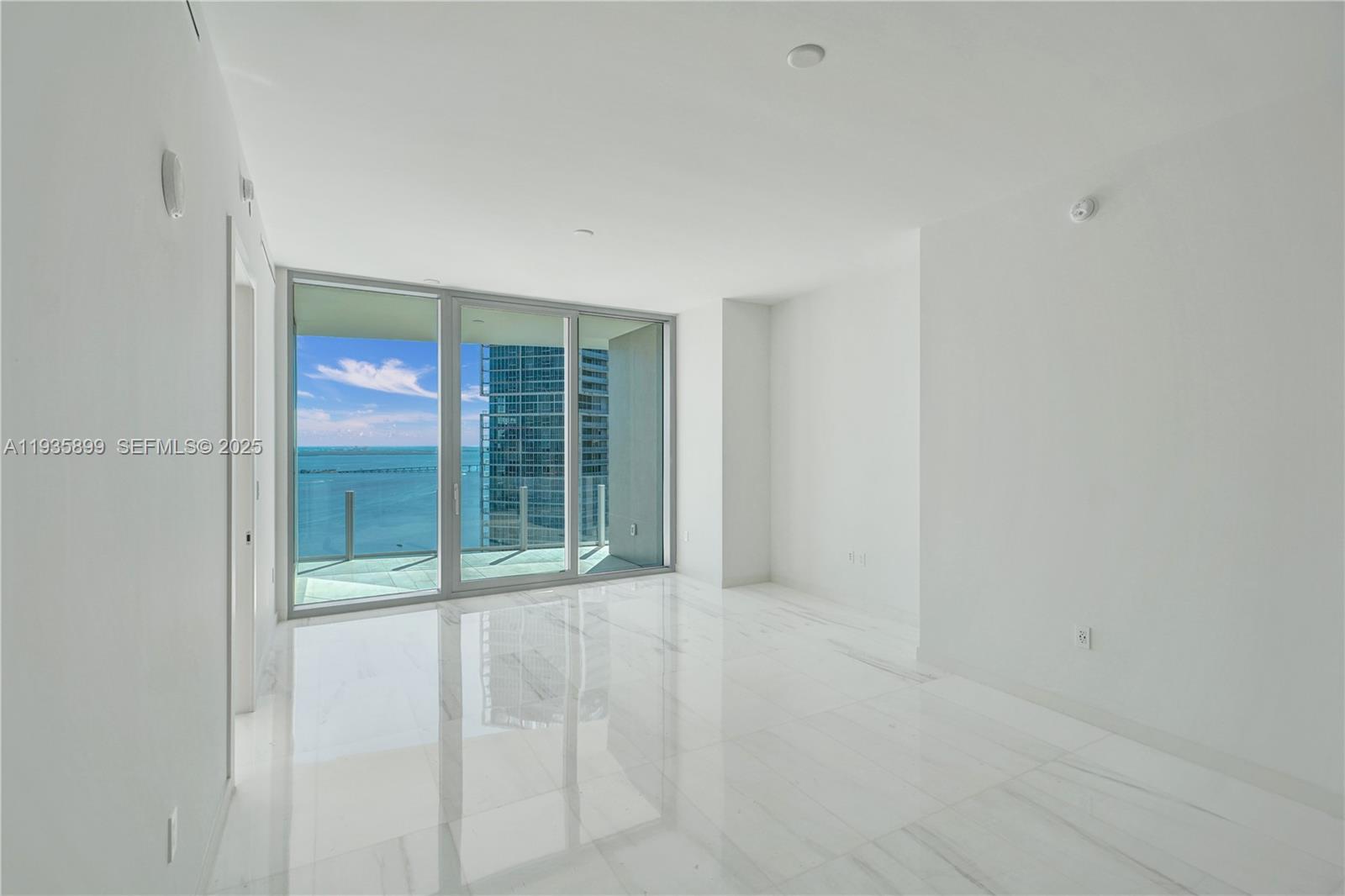 300 Biscayne Blvd Way, Unit 3605W Miami, FL 33131 - Photo 29 of 65 a view of an empty room with glass door