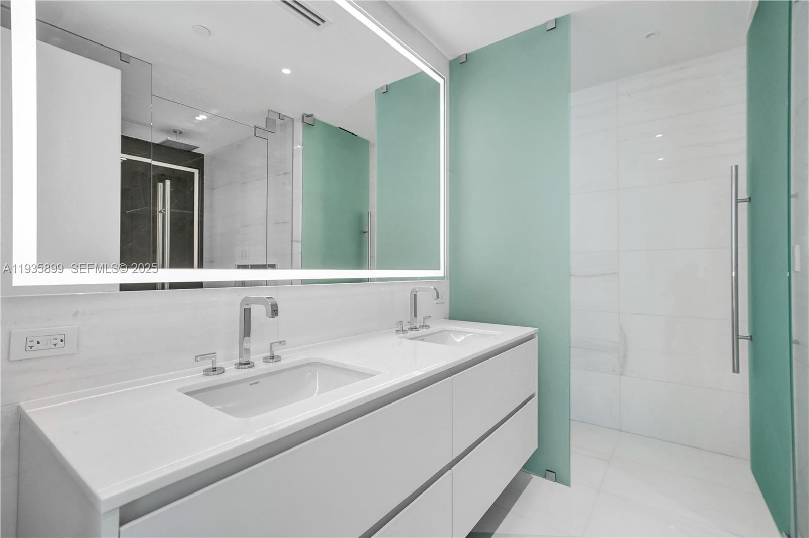 300 Biscayne Blvd Way, Unit 3605W Miami, FL 33131 - Photo 37 of 65 a bathroom with a sink and a mirror