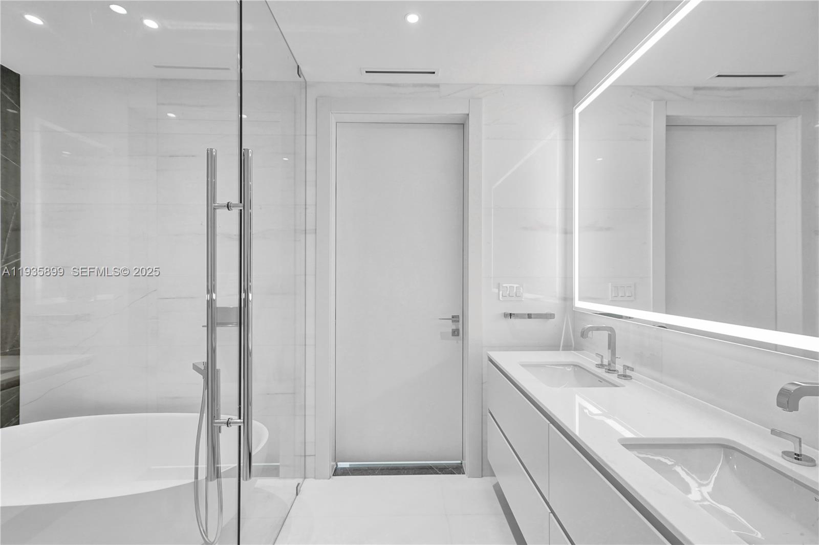 300 Biscayne Blvd Way, Unit 3605W Miami, FL 33131 - Photo 38 of 65 a bathroom with a tub sink shower and two mirror