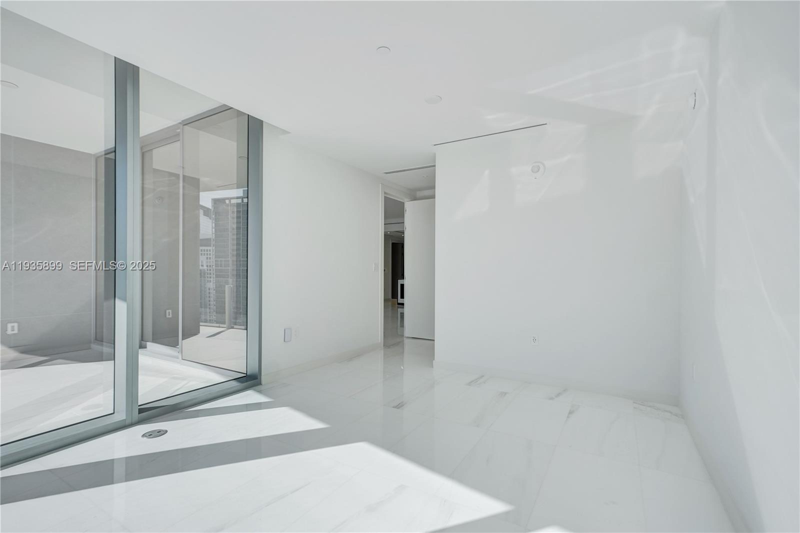 300 Biscayne Blvd Way, Unit 3605W Miami, FL 33131 - Photo 46 of 65 a bathroom with a bathtub and a shower