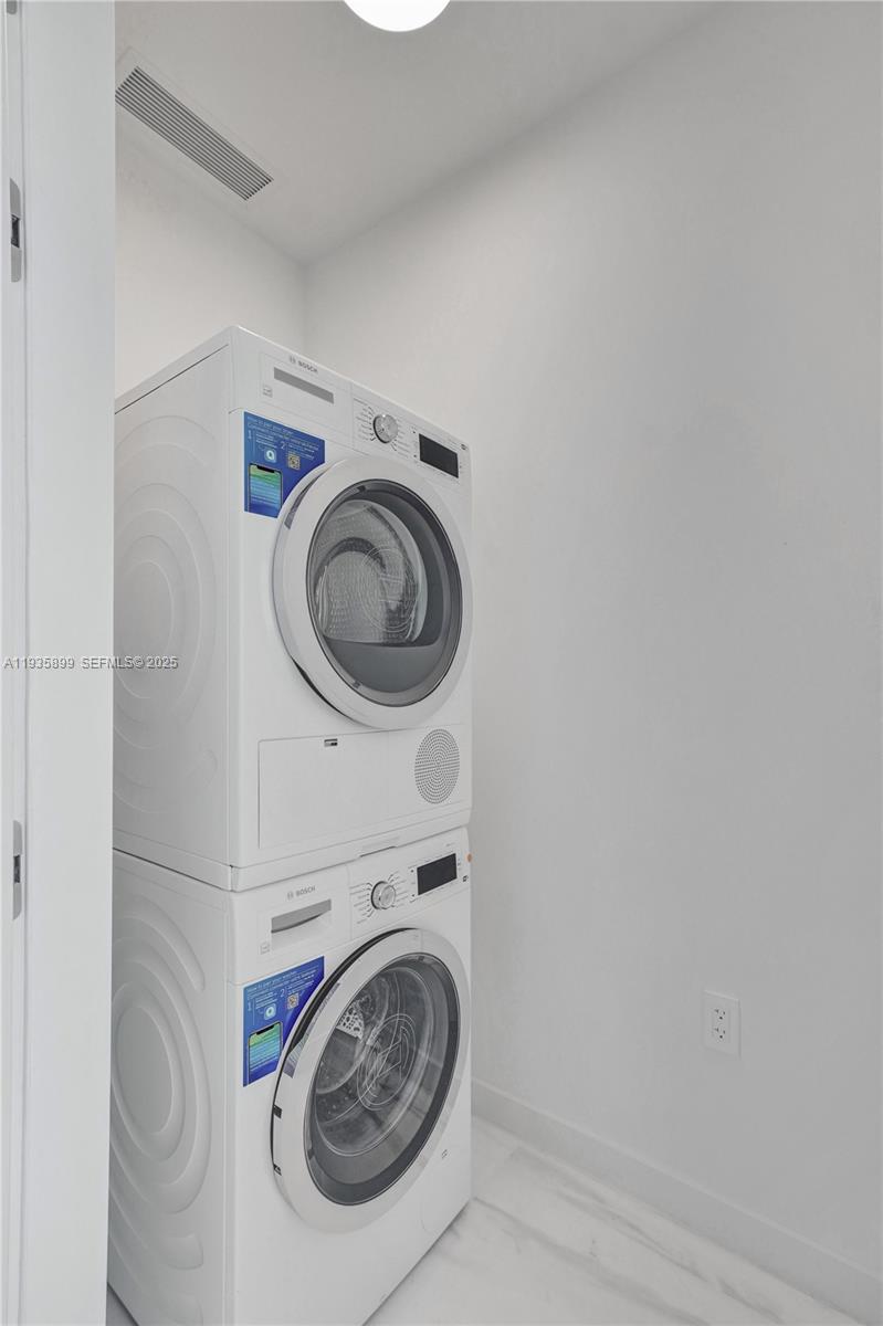 300 Biscayne Blvd Way, Unit 3605W Miami, FL 33131 - Photo 59 of 65 a utility room with dryer and washer