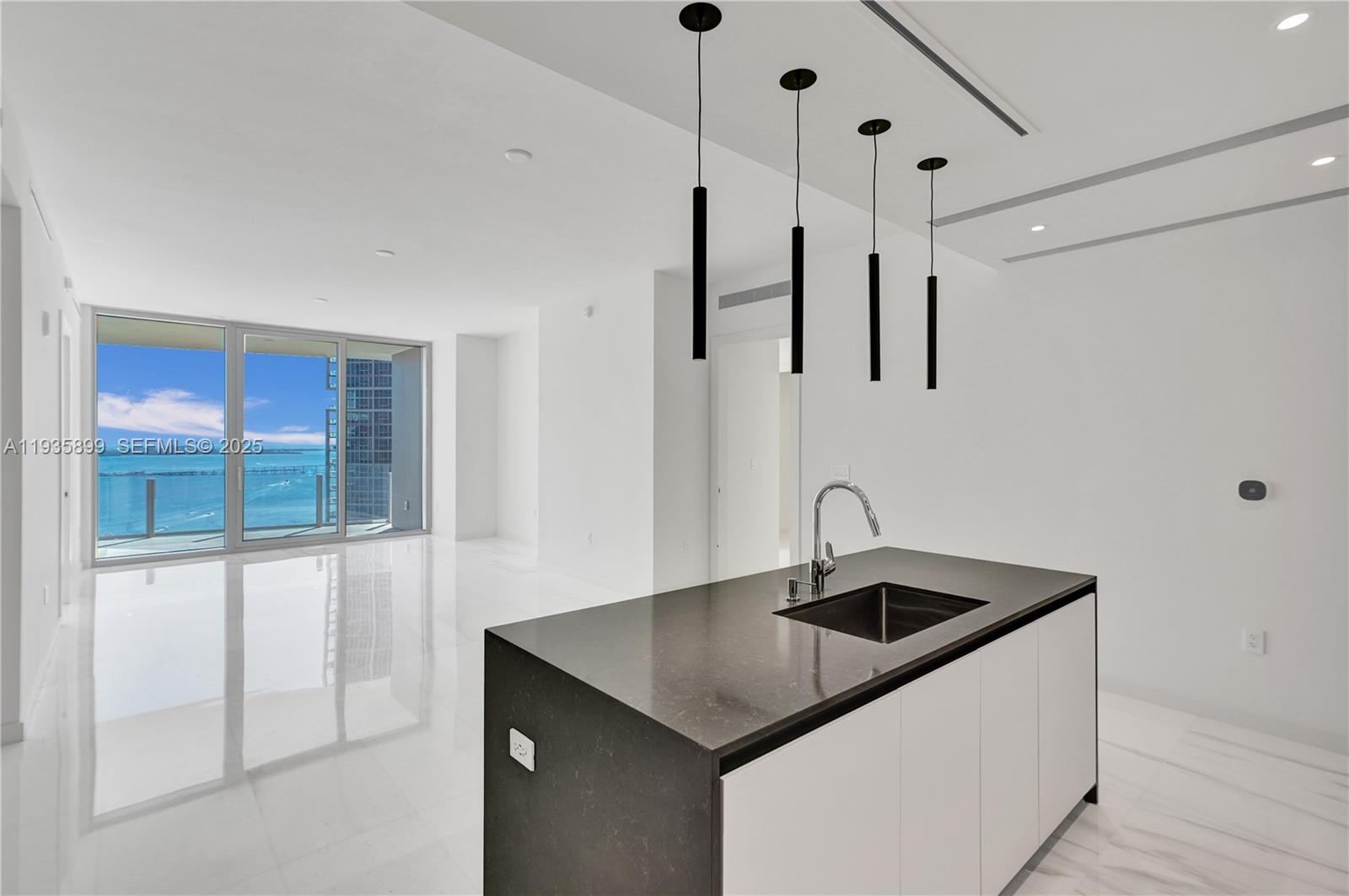 300 Biscayne Blvd Way, Unit 3605W Miami, FL 33131 - Photo 10 of 65 a kitchen that has a sink a window and cabinets