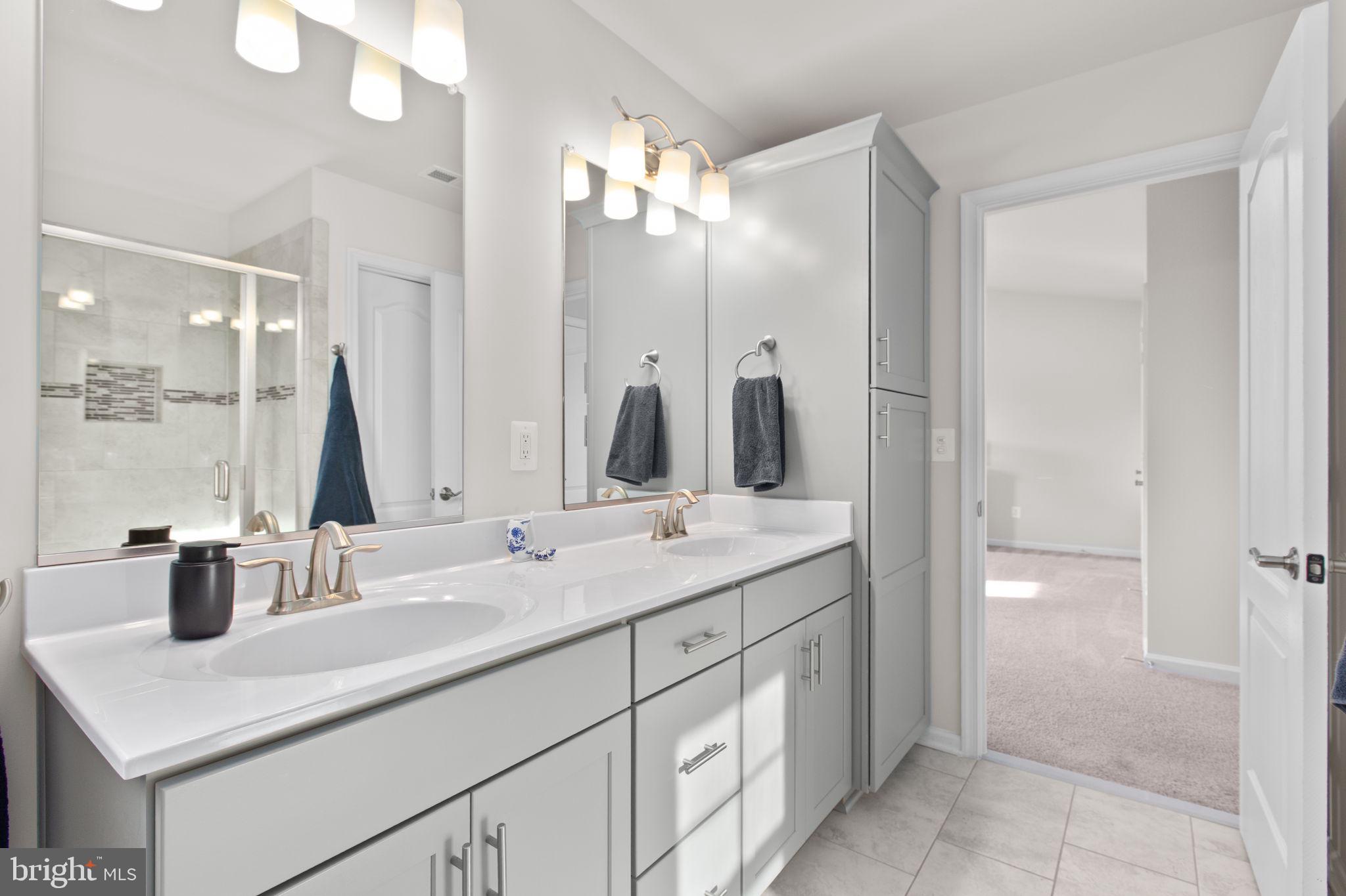 8 Shermans Ridge Road Stafford, VA 22554 - Photo 17 of 37 a bathroom with a double vanity sink and a mirror