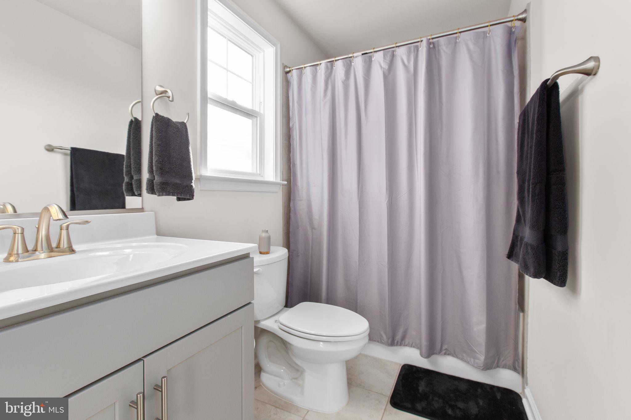 8 Shermans Ridge Road Stafford, VA 22554 - Photo 20 of 37 a bathroom with a granite countertop sink toilet and mirror