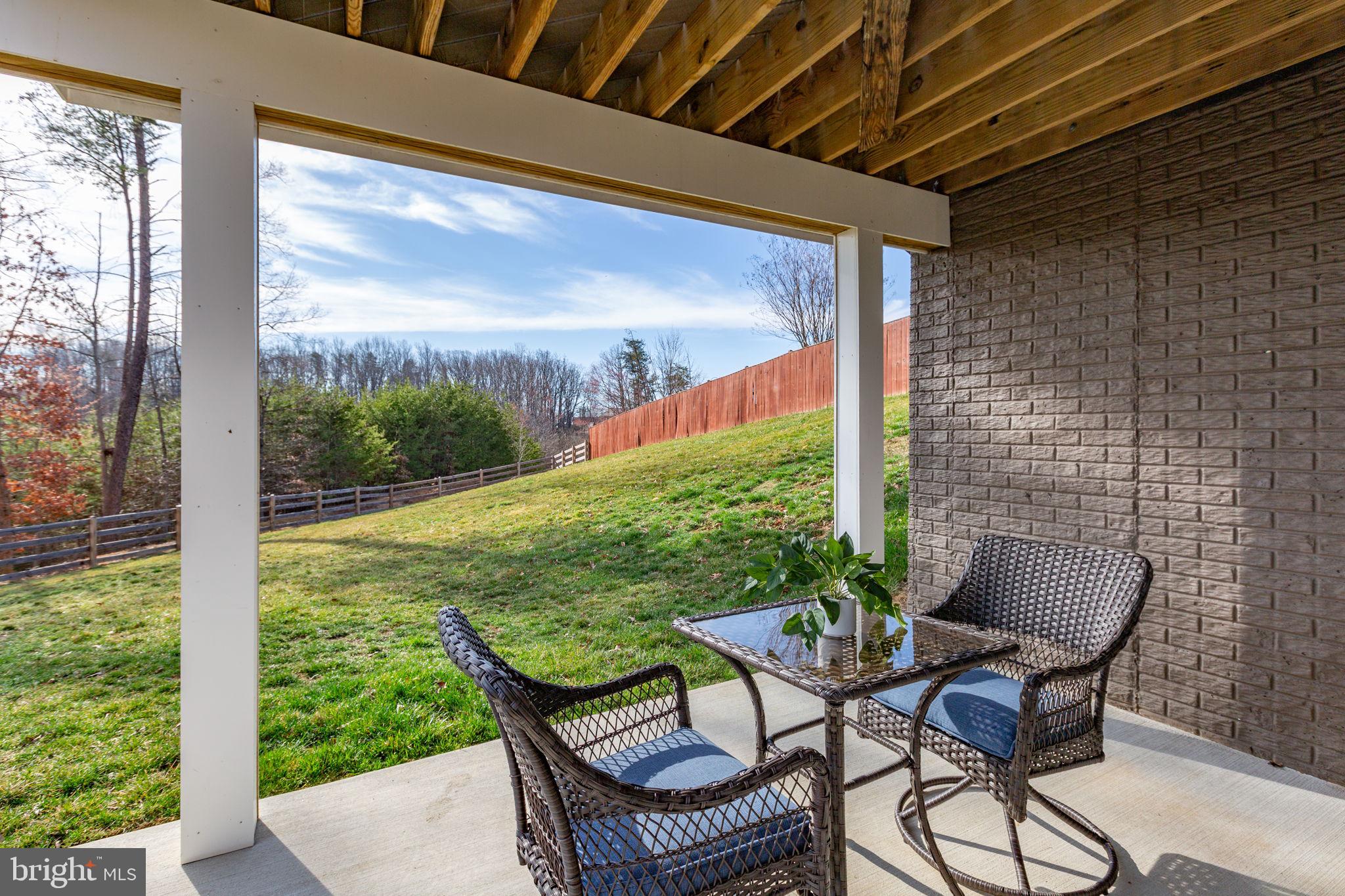 8 Shermans Ridge Road Stafford, VA 22554 - Photo 29 of 37 a view of a chair and table in patio with a backyard