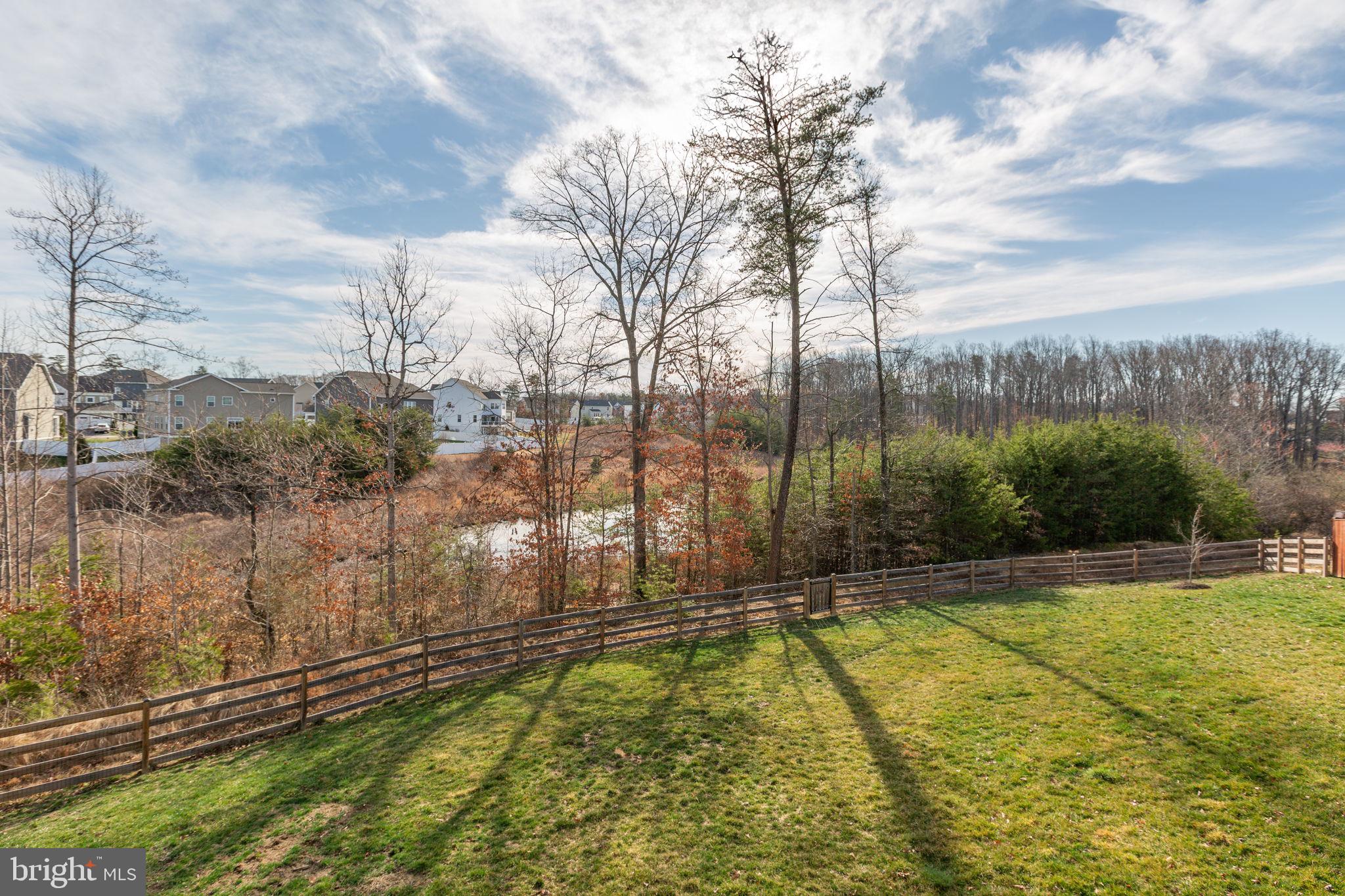 8 Shermans Ridge Road Stafford, VA 22554 - Photo 32 of 37 a view of a swimming pool with a yard and large trees